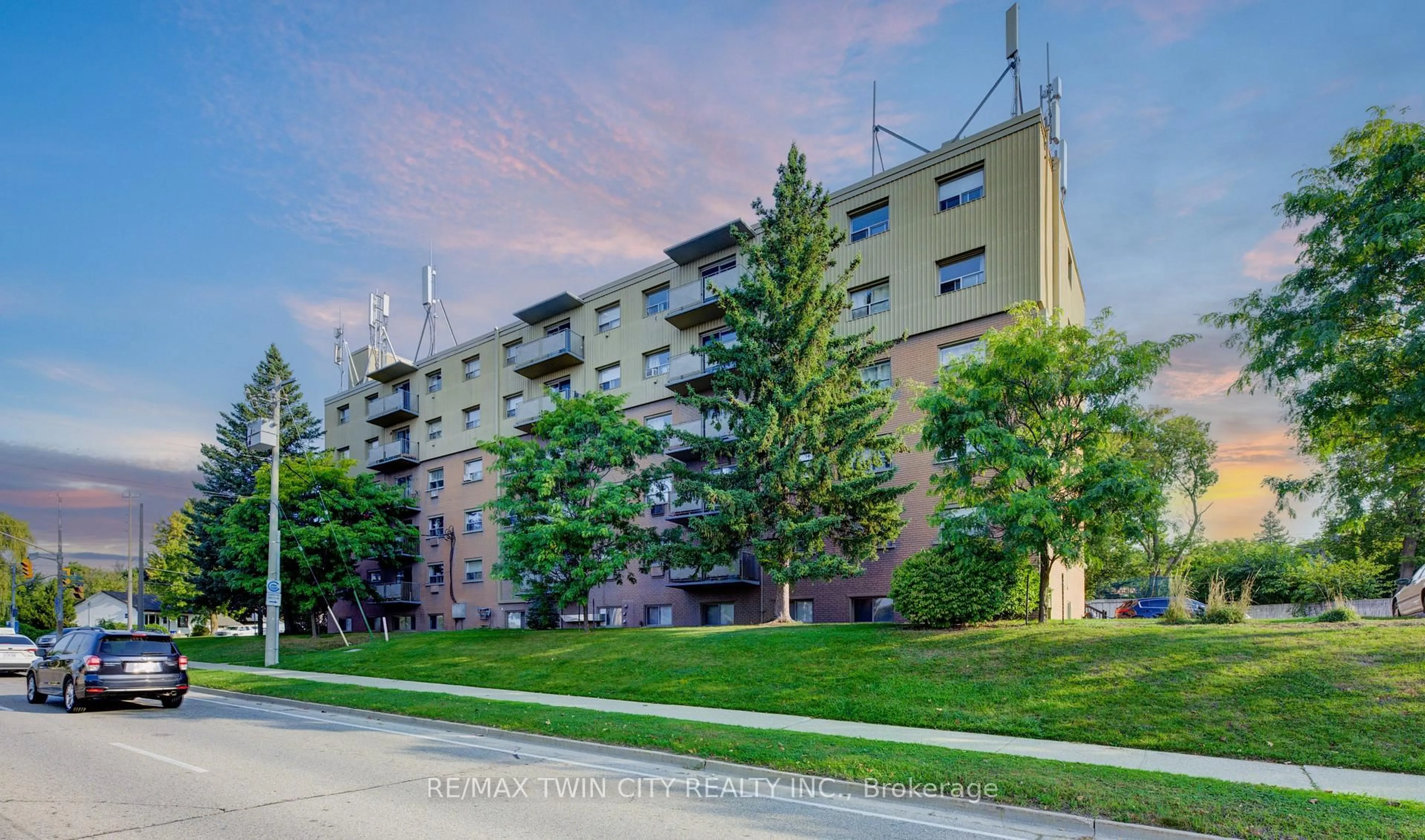 A pic from outside/outdoor area/front of a property/back of a property/a pic from drone, street for 283 Fairway Rd #201, Kitchener Ontario N2A 2P1