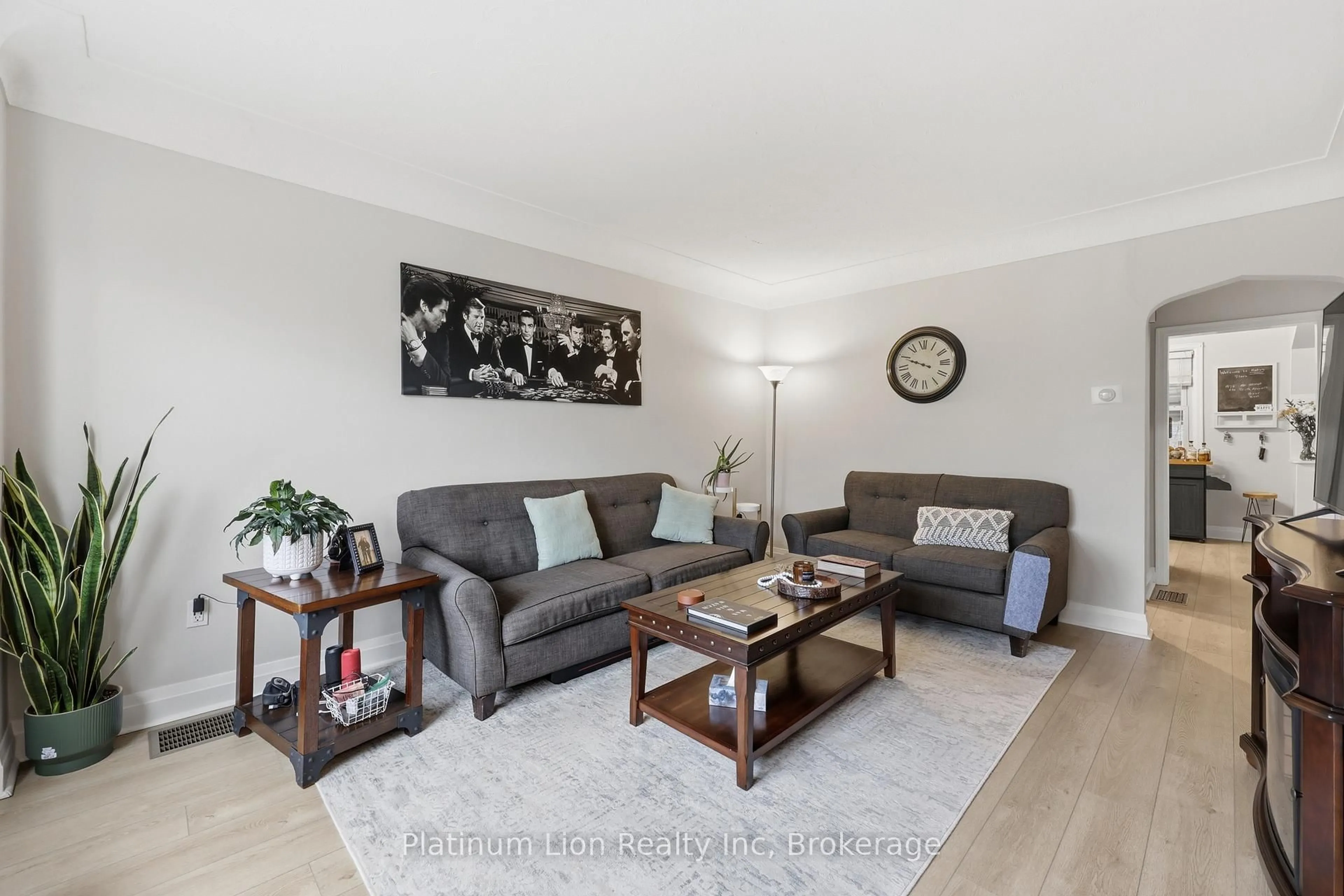 Living room with furniture, wood/laminate floor for 258 Cloverdale Ave, Hamilton Ontario L8K 4M6