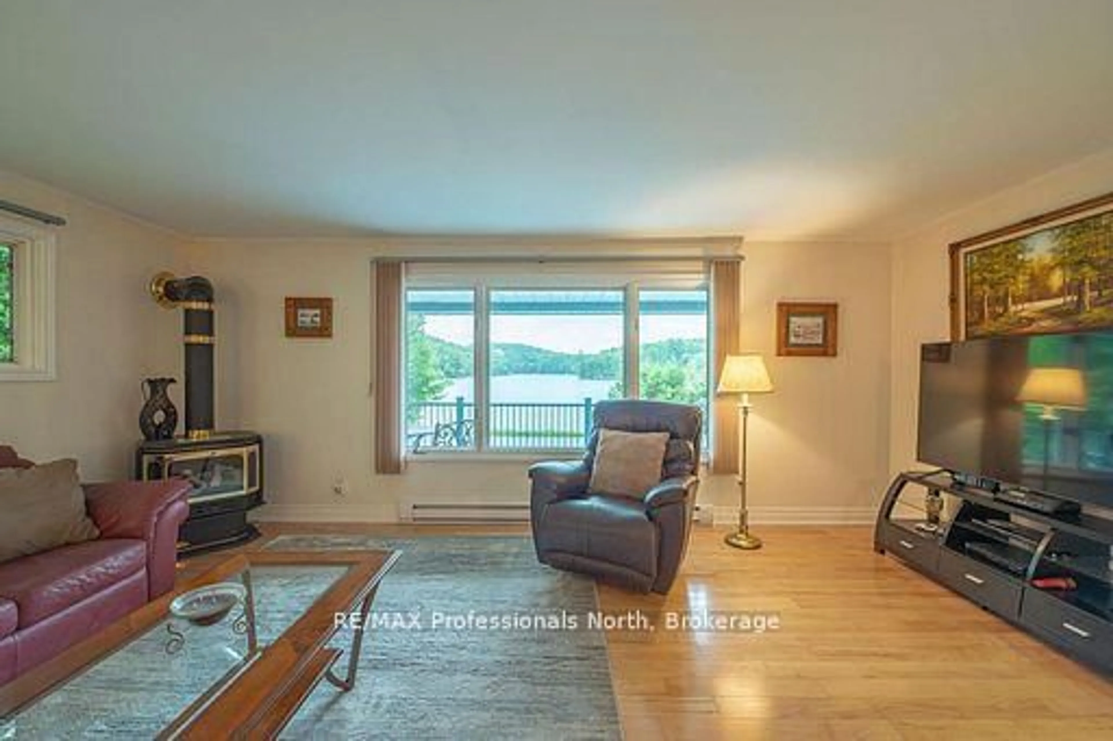 Living room with furniture, wood/laminate floor for 1981 Horseshoe Lake Rd, Minden Hills Ontario K0M 2K0