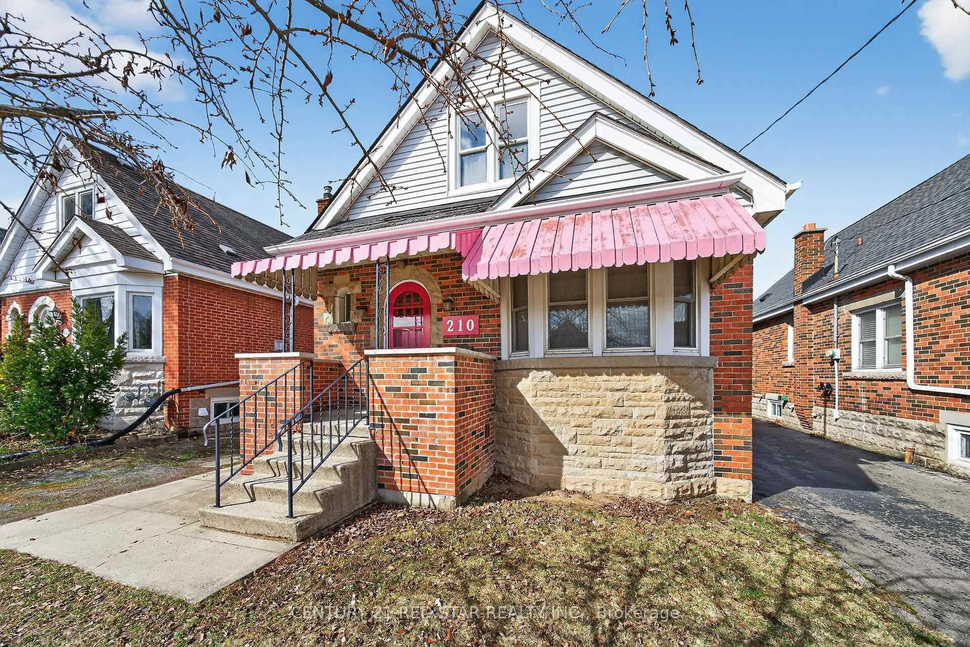 Home with brick exterior material, street for 210 Huxley Ave, Hamilton Ontario L8K 2R3
