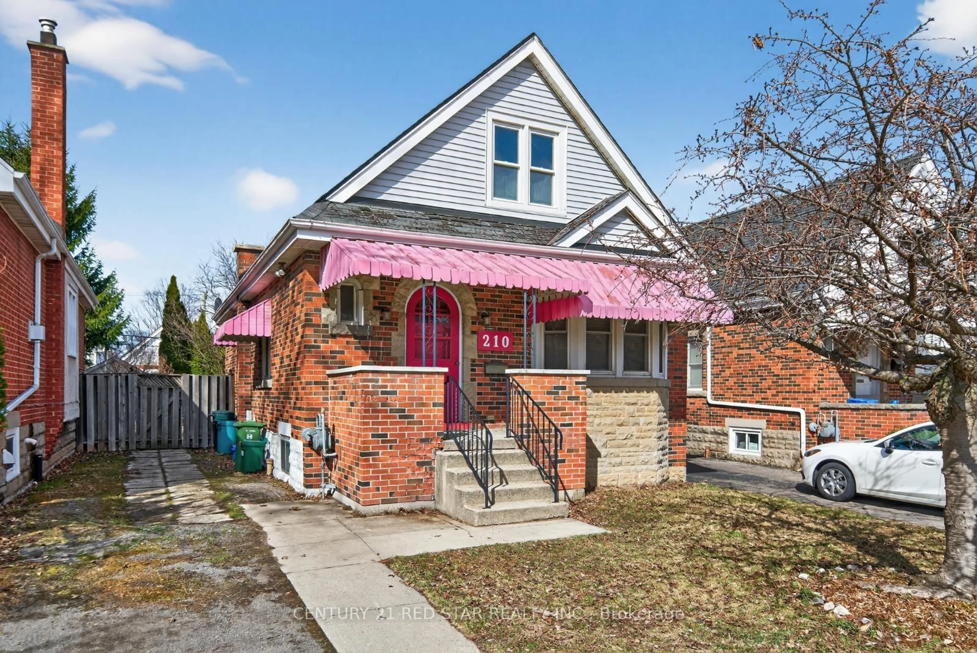 Home with brick exterior material, street for 210 Huxley Ave, Hamilton Ontario L8K 2R3