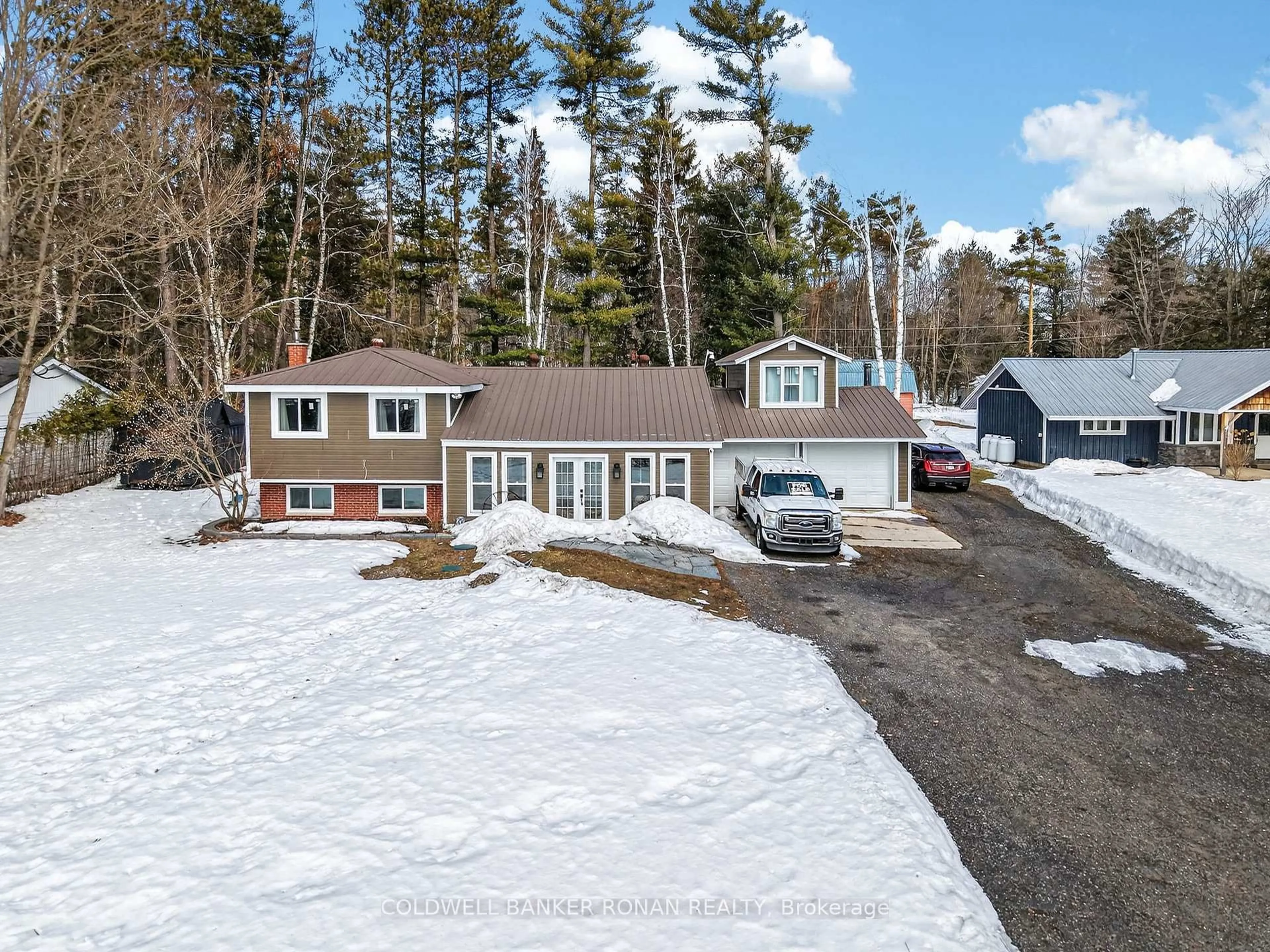 A pic from outside/outdoor area/front of a property/back of a property/a pic from drone, street for 363 Santas Village Rd, Bracebridge Ontario P1L 1W8
