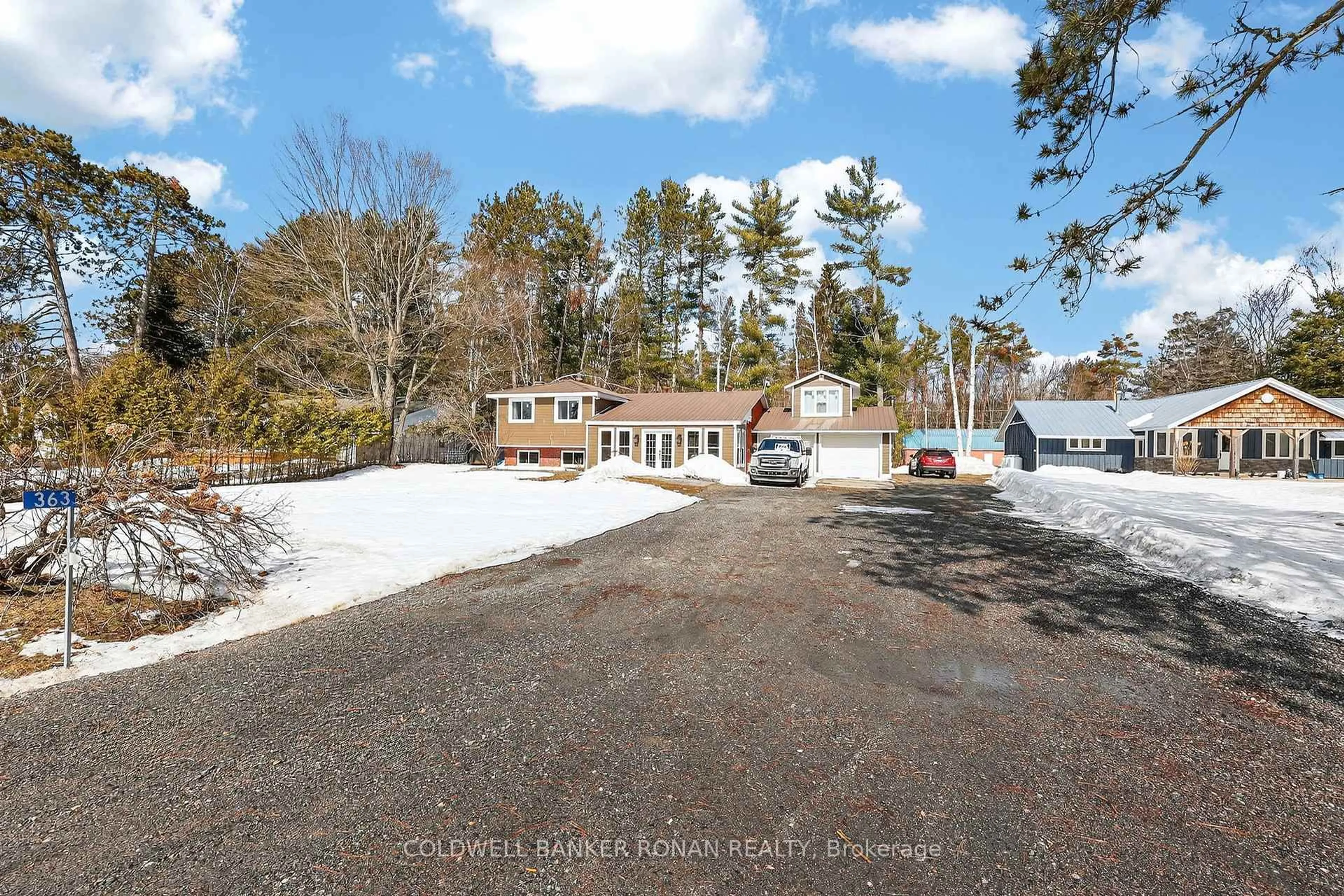 A pic from outside/outdoor area/front of a property/back of a property/a pic from drone, street for 363 Santas Village Rd, Bracebridge Ontario P1L 1W8