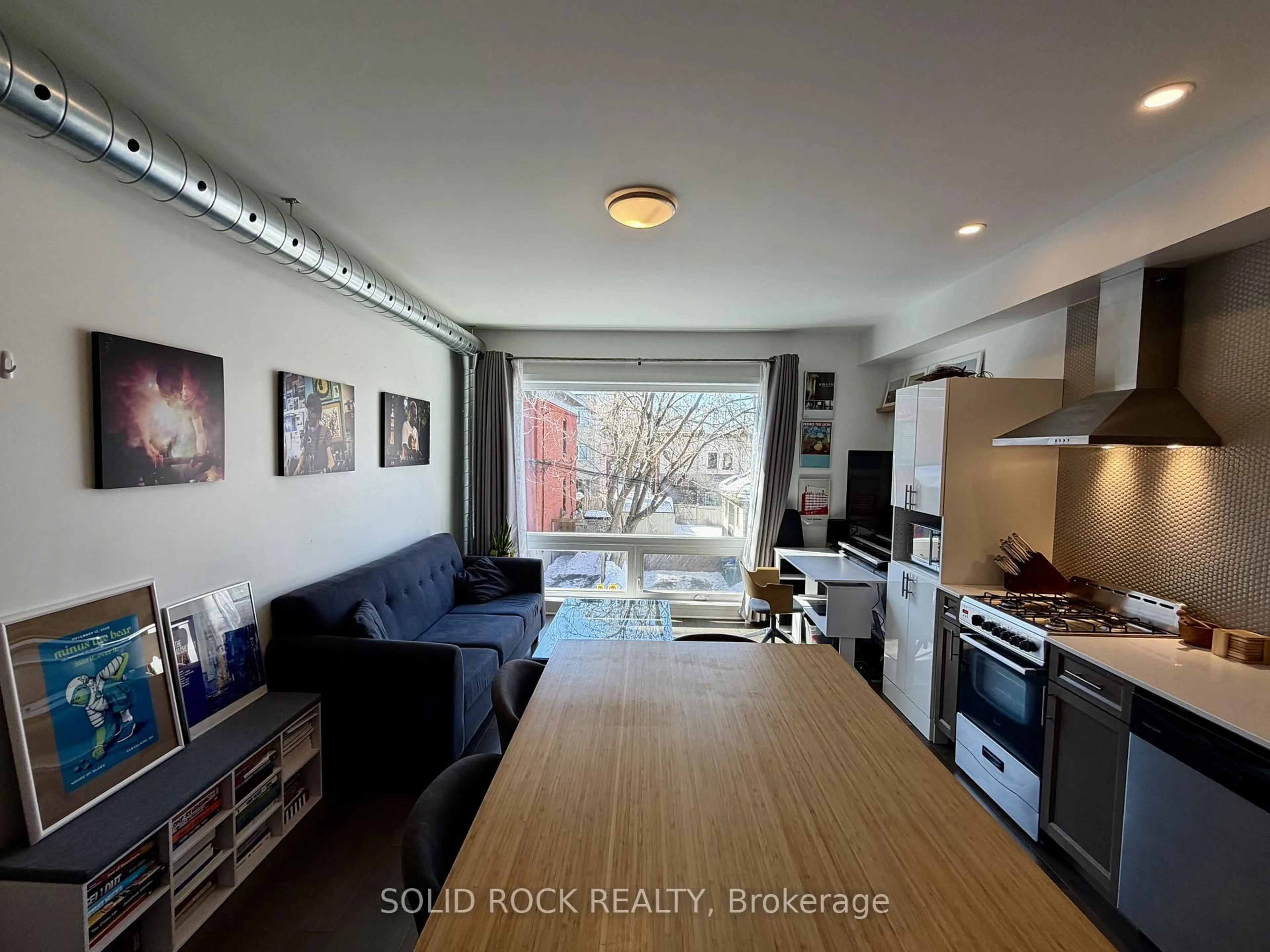 Open concept kitchen, wood/laminate floor for 22 Perkins St #204, Ottawa Ontario K1R 7G5