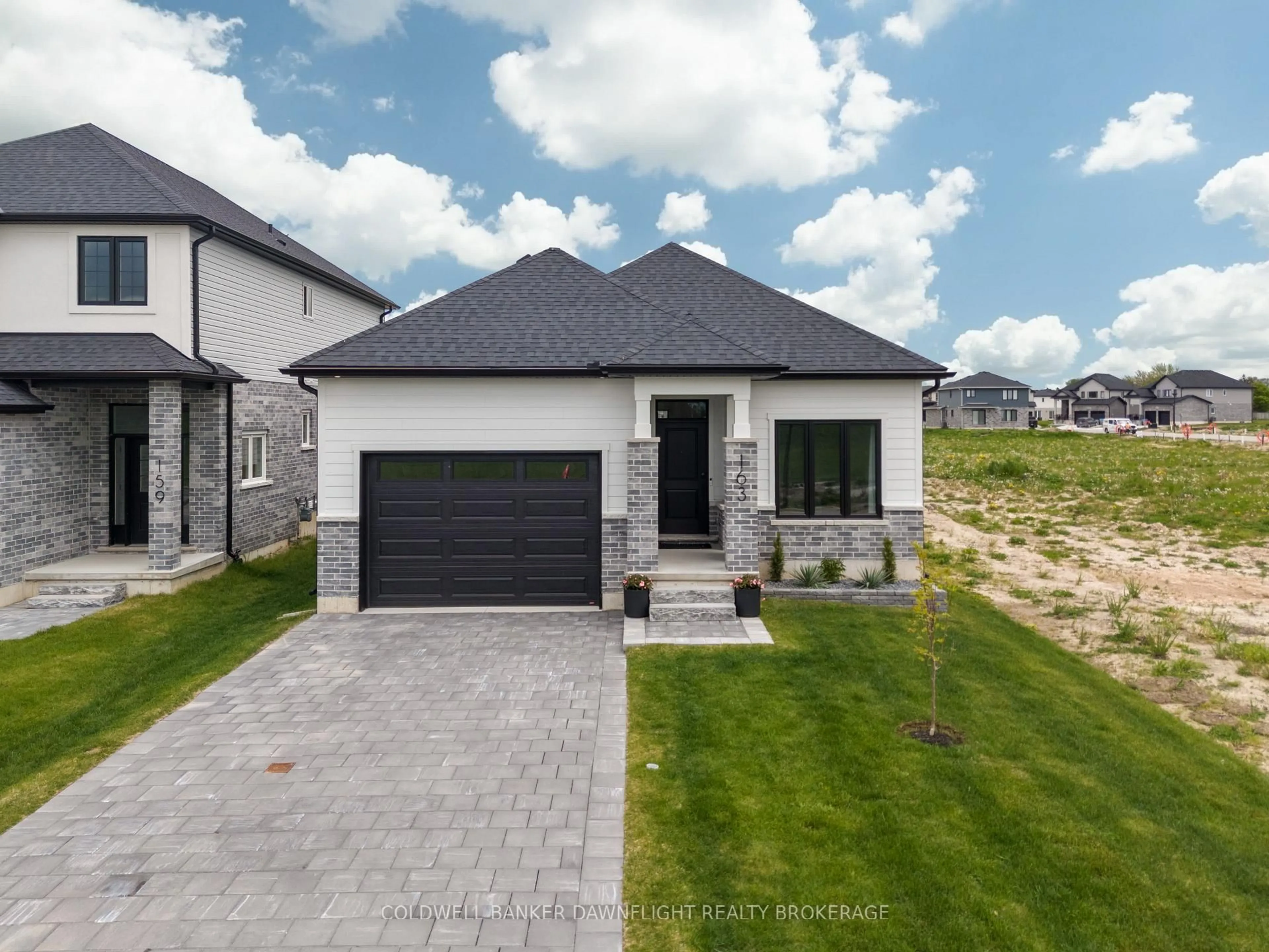 Home with brick exterior material, street for 219 Greene St, South Huron Ontario N0M 1S3