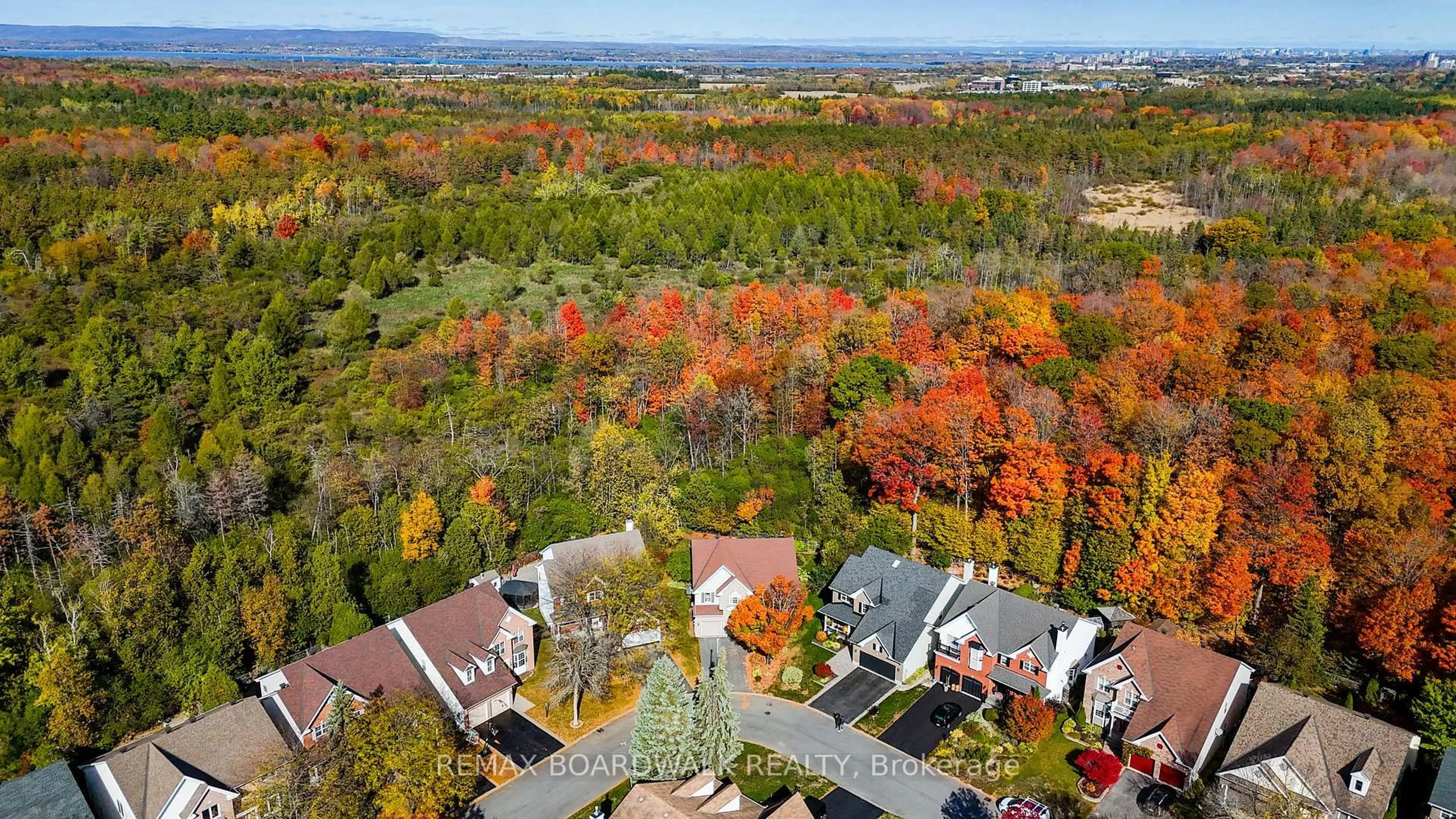 A pic from outside/outdoor area/front of a property/back of a property/a pic from drone, forest/trees view for 57 Mattawa Cres, Ottawa Ontario K2M 2E8