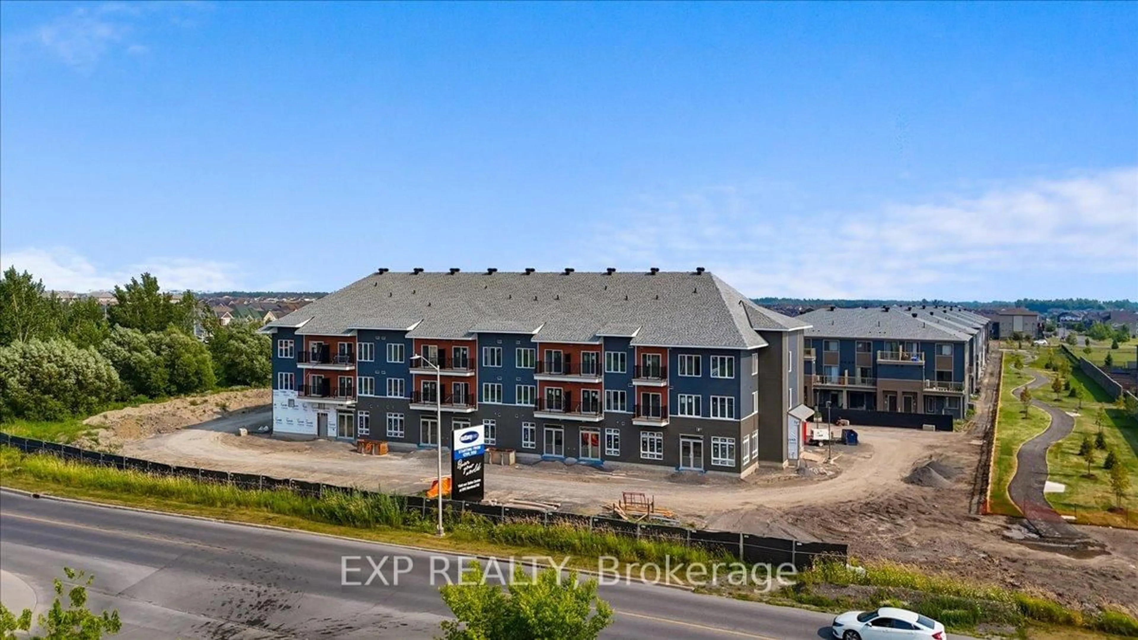 A pic from outside/outdoor area/front of a property/back of a property/a pic from drone, building for 2376 Tenth Line Rd #208, Ottawa Ontario K4A 0M7