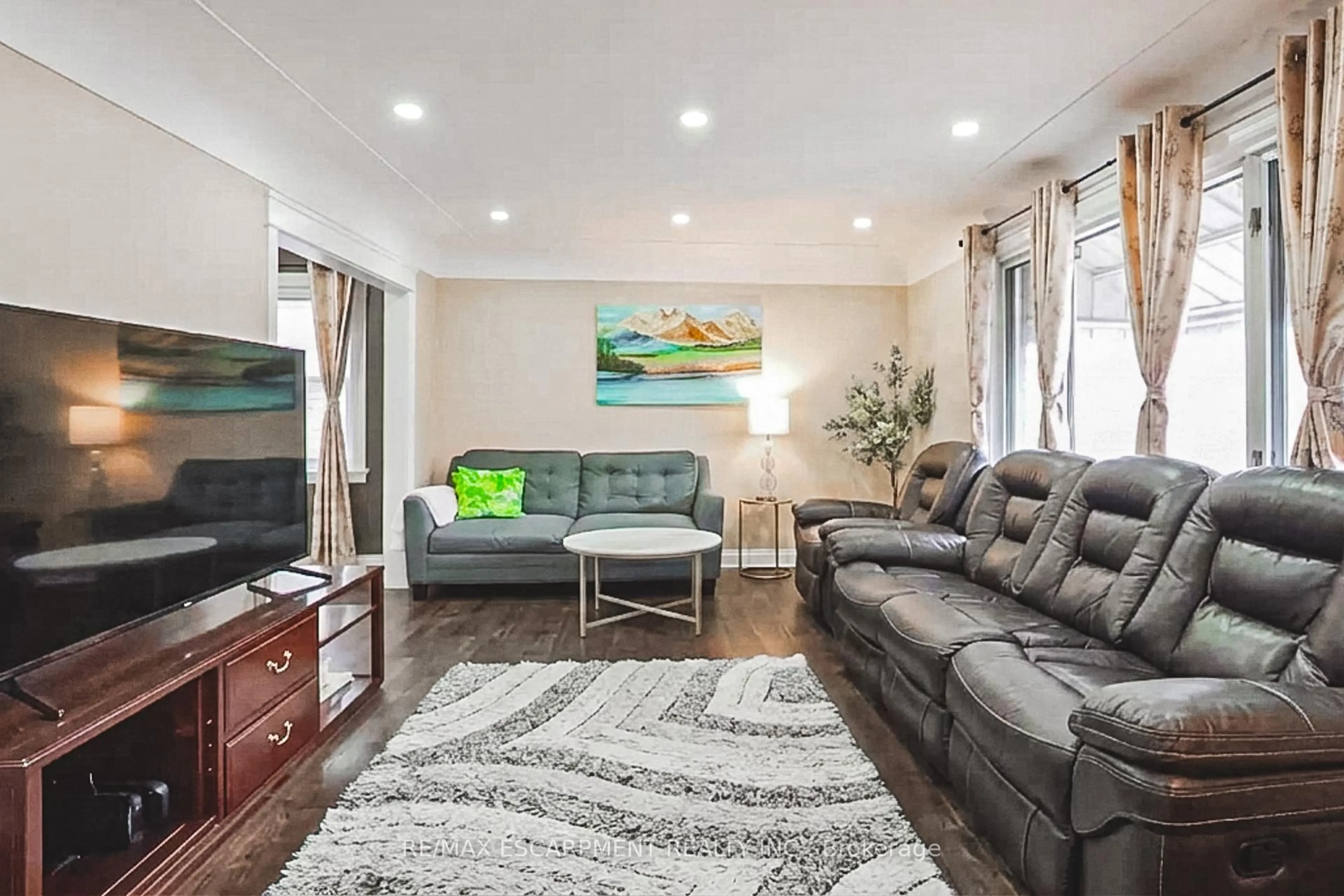 Living room with furniture, wood/laminate floor for 5 West 3rd St, Hamilton Ontario L9C 3J5