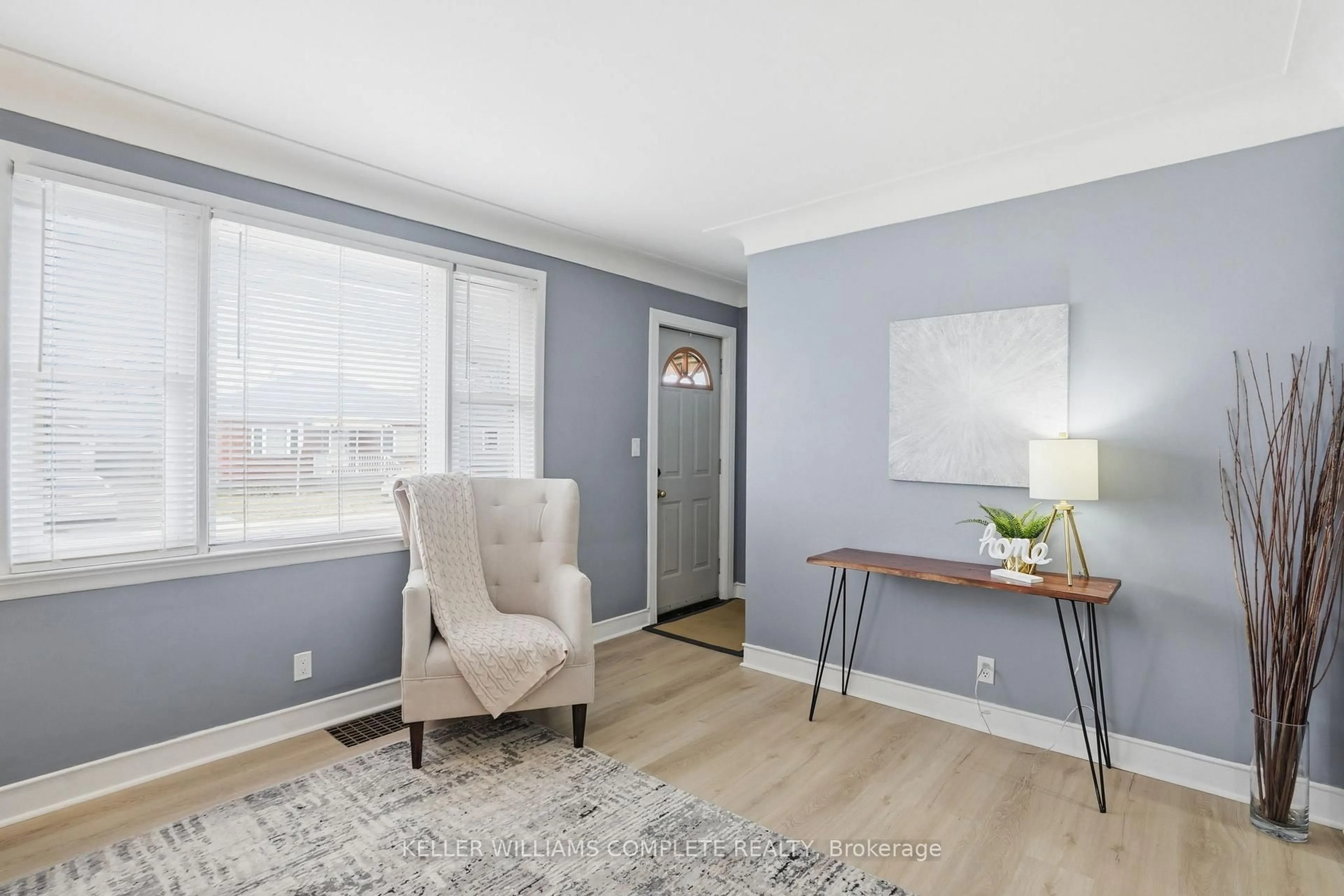 Living room with furniture, wood/laminate floor for 7 West 1st St, Hamilton Ontario L9C 3B5