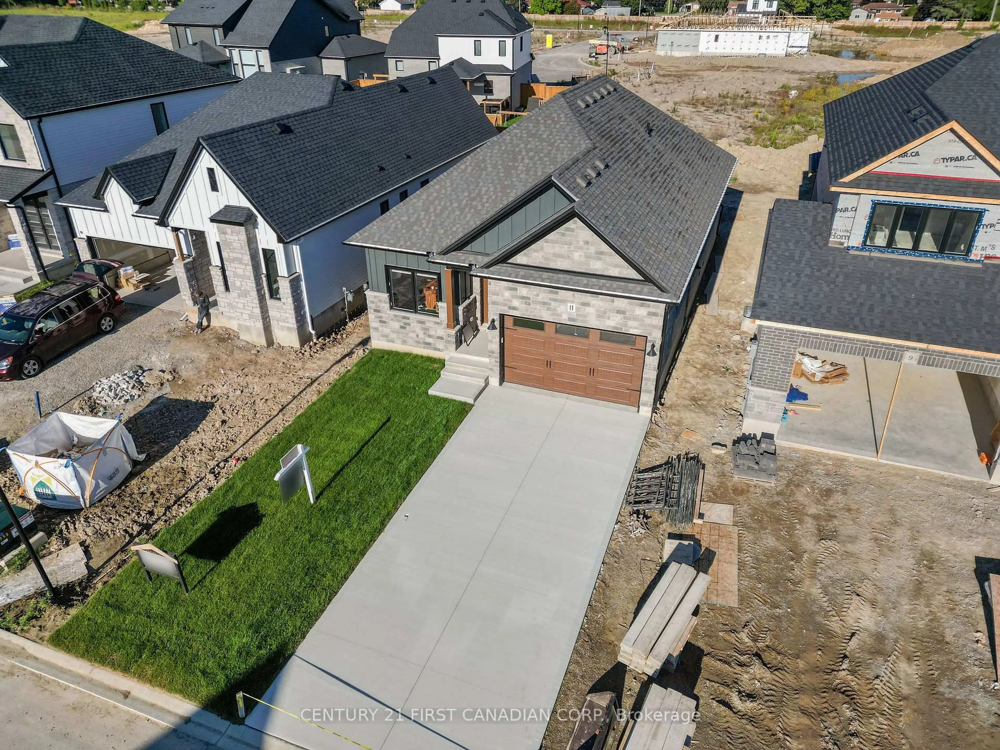 A pic from outside/outdoor area/front of a property/back of a property/a pic from drone, street for 11 Sheldabren St, North Middlesex Ontario N0M 1A0