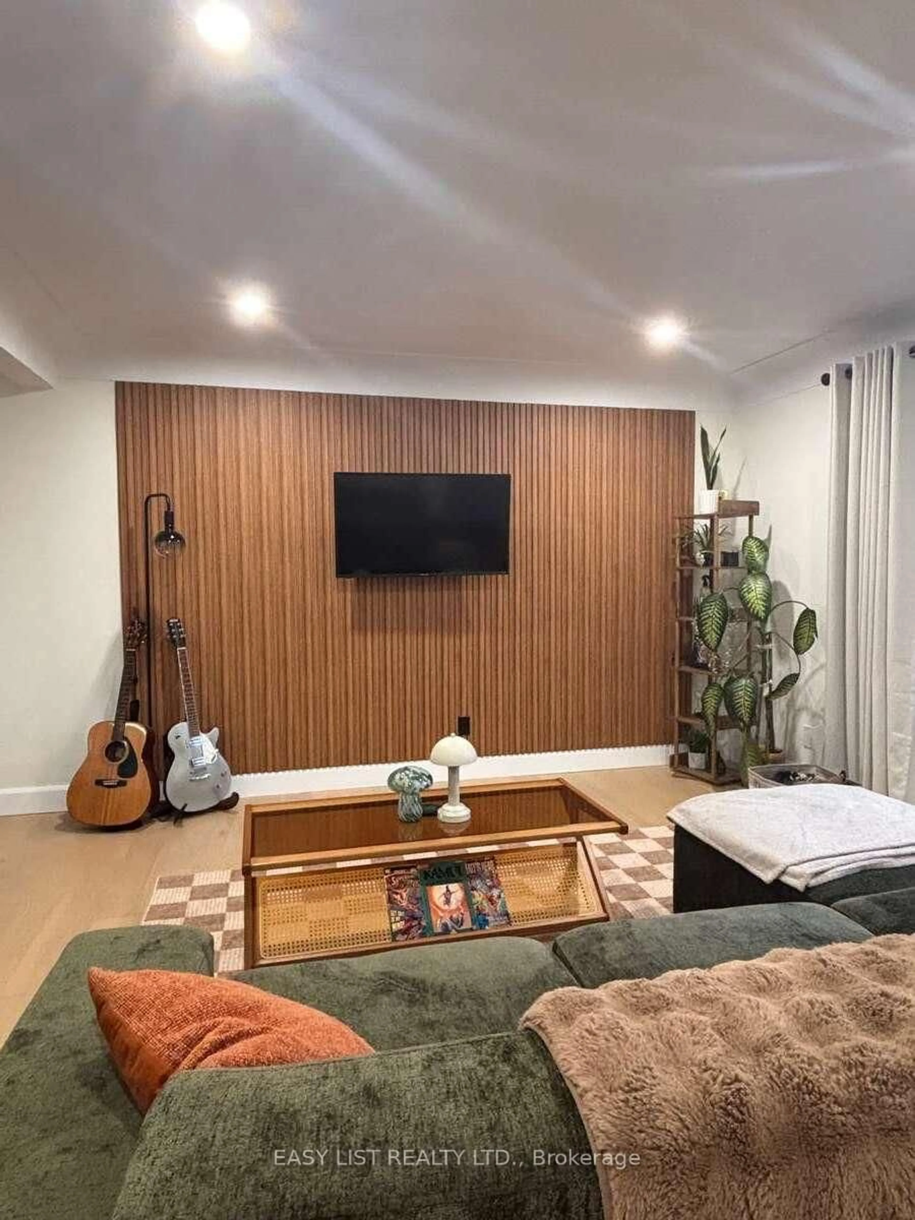 Living room with furniture, wood/laminate floor for 345 Head St, Strathroy-Caradoc Ontario N7G 2J8