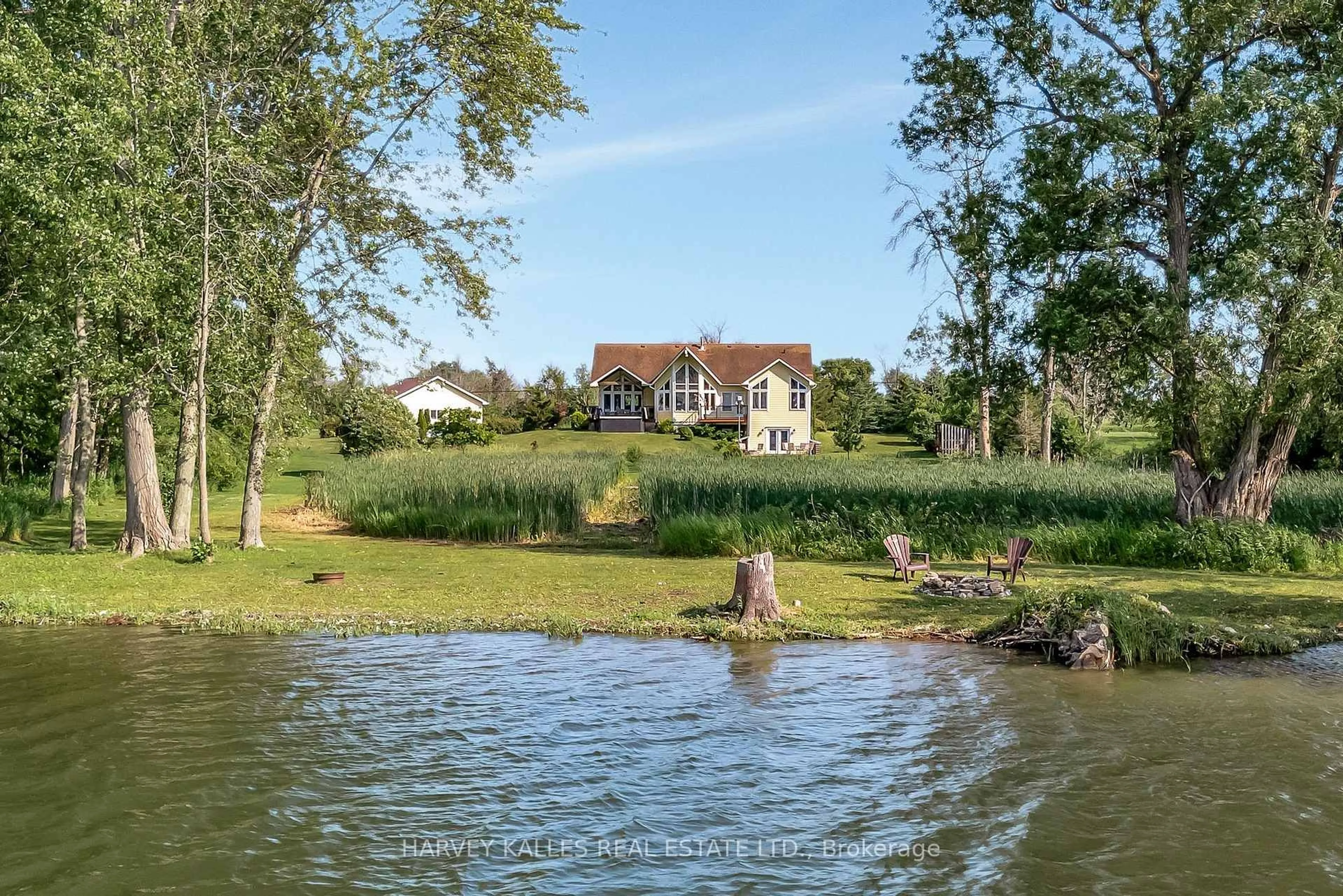 A pic from outside/outdoor area/front of a property/back of a property/a pic from drone, water/lake/river/ocean view for 2535 County Road 13 Rd, Prince Edward County Ontario K0K 2T0