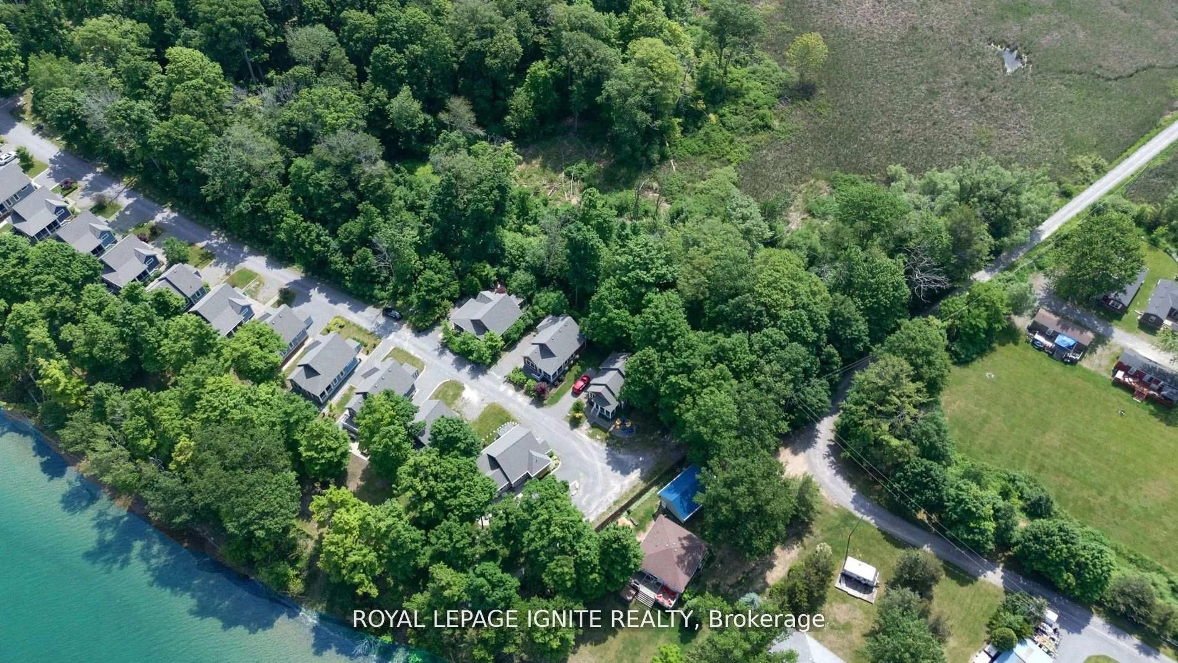 A pic from outside/outdoor area/front of a property/back of a property/a pic from drone, water/lake/river/ocean view for 19 Summer Village Lane #208, Prince Edward County Ontario K0K 1P0