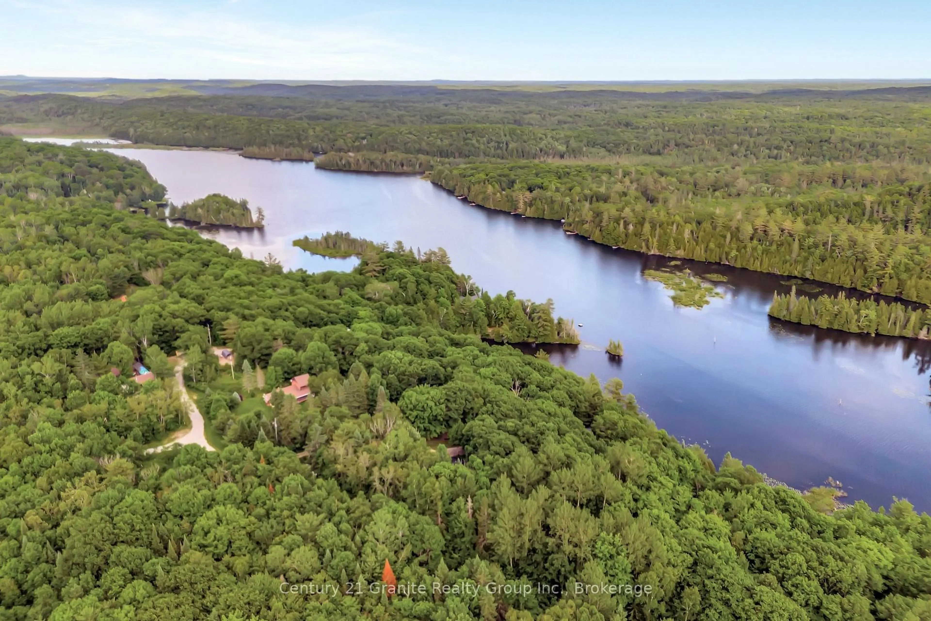 A pic from outside/outdoor area/front of a property/back of a property/a pic from drone, water/lake/river/ocean view for 1031 Rotunda Dr, Highlands East Ontario K0M 1R0