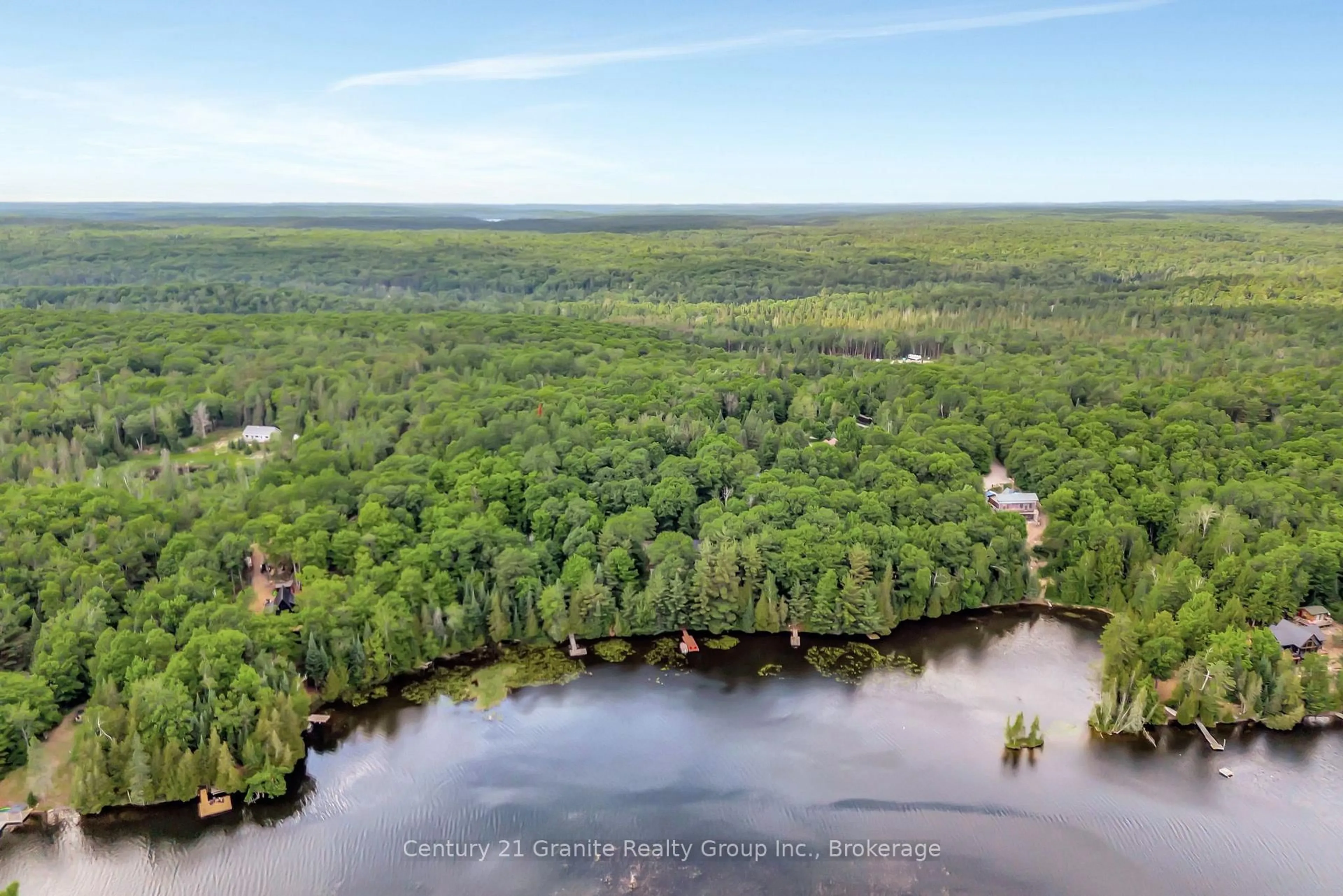 A pic from outside/outdoor area/front of a property/back of a property/a pic from drone, water/lake/river/ocean view for 1031 Rotunda Dr, Highlands East Ontario K0M 1R0