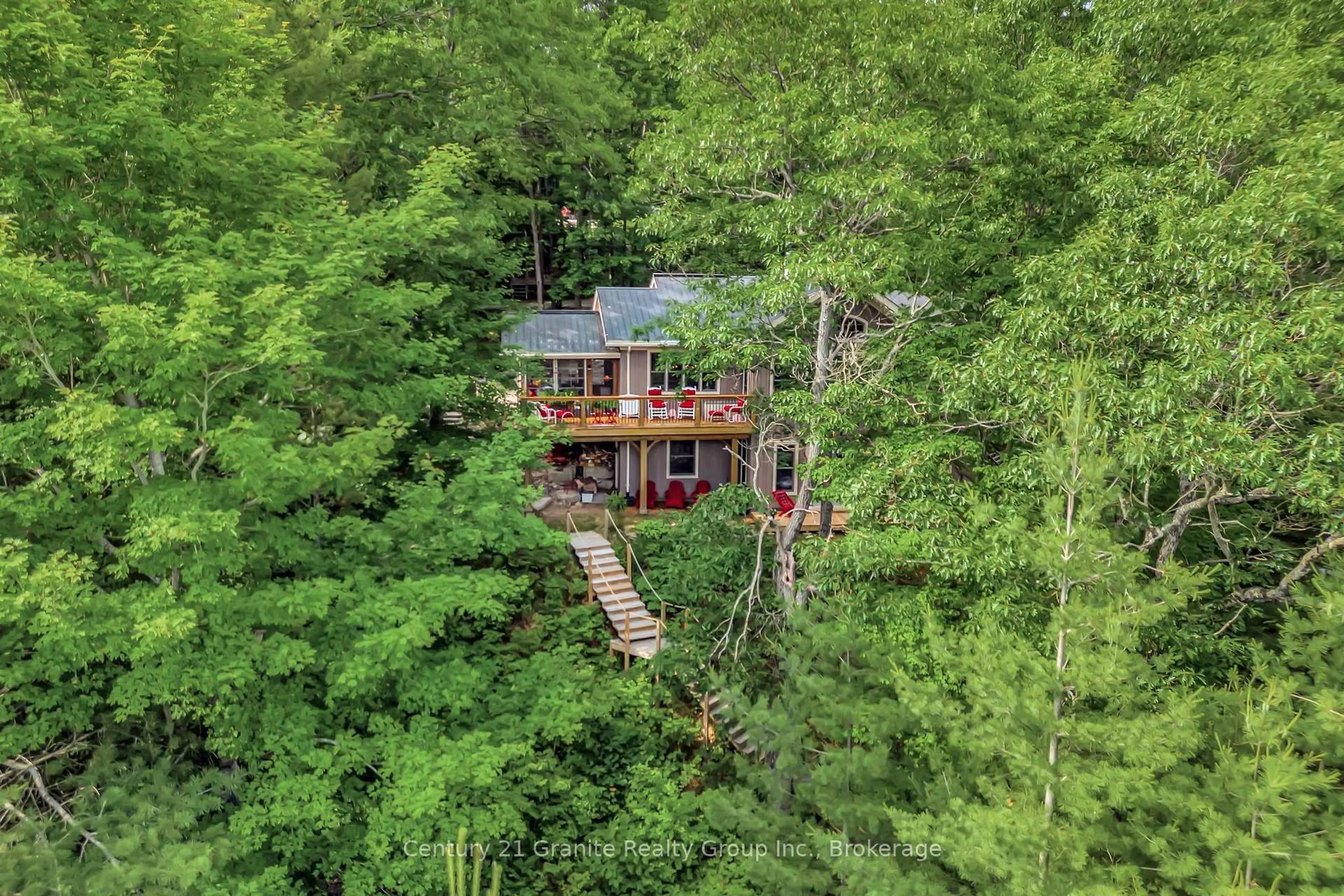 A pic from outside/outdoor area/front of a property/back of a property/a pic from drone, forest/trees view for 1031 Rotunda Dr, Highlands East Ontario K0M 1R0