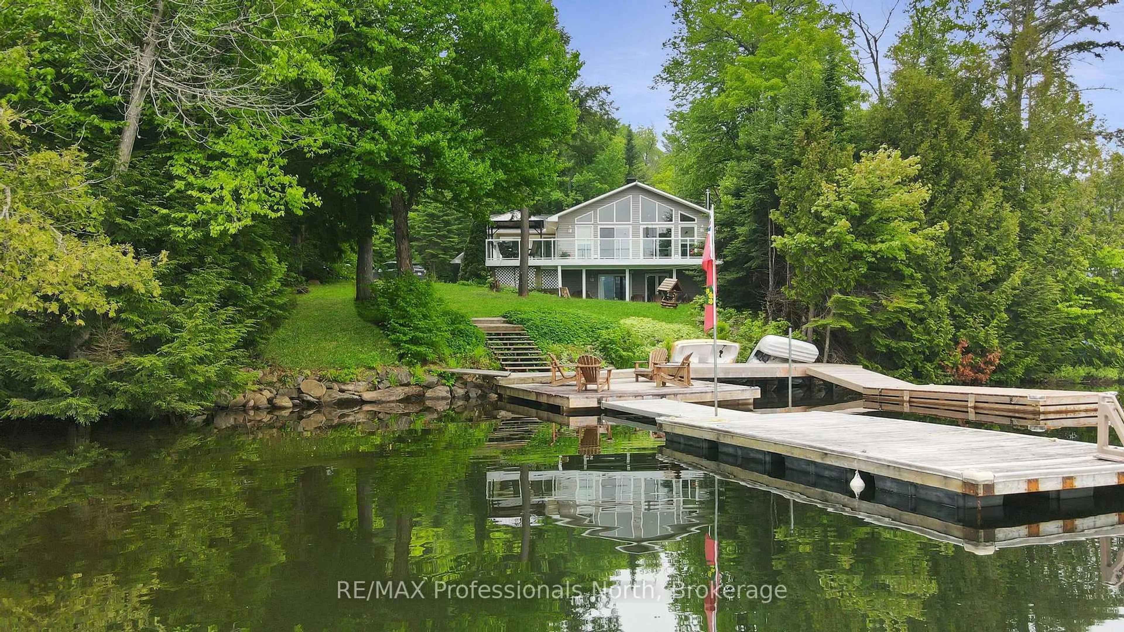 A pic from outside/outdoor area/front of a property/back of a property/a pic from drone, water/lake/river/ocean view for 1093 Comak Cres, Algonquin Highlands Ontario K0M 1S0