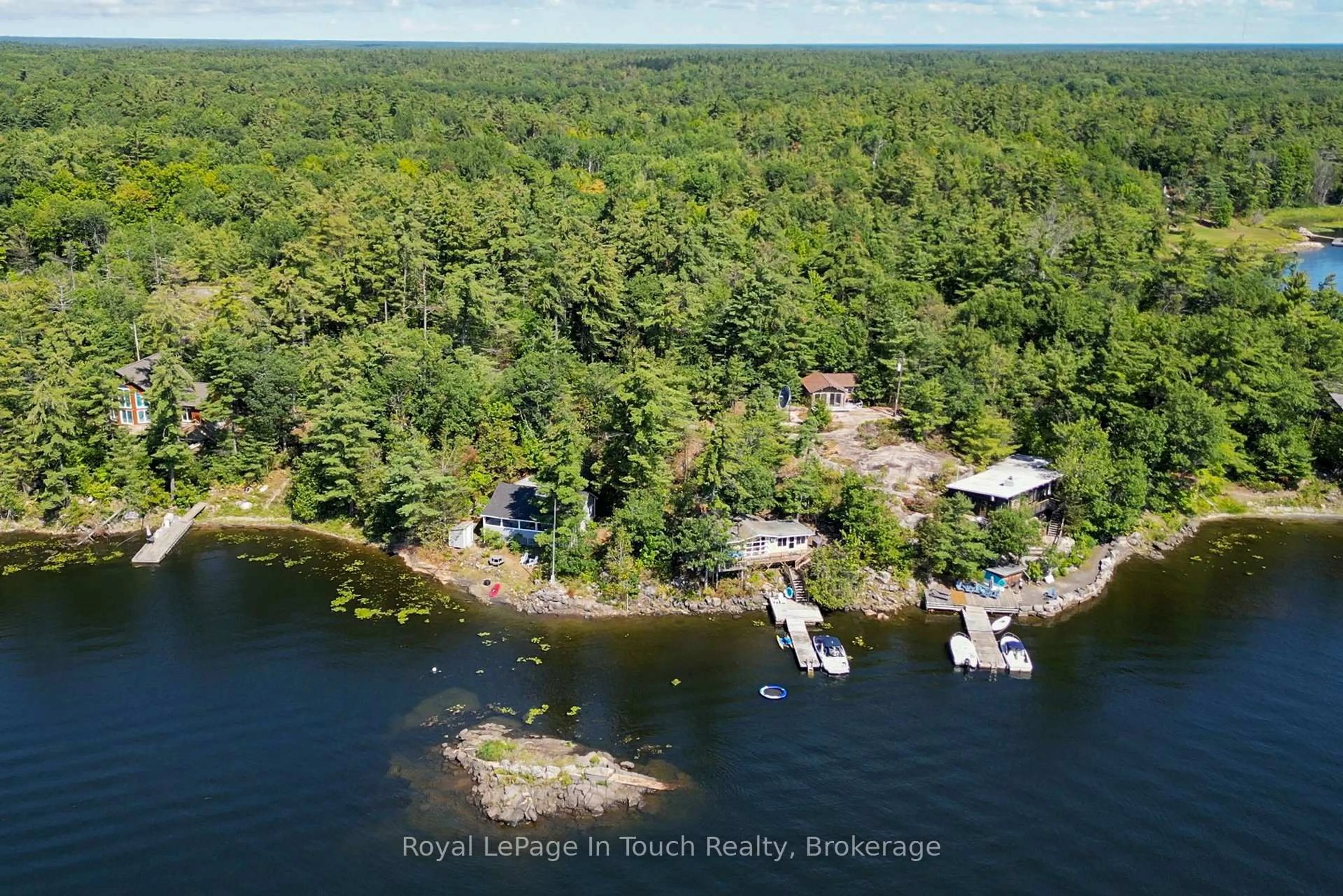 A pic from outside/outdoor area/front of a property/back of a property/a pic from drone, water/lake/river/ocean view for 13182 Georgian Bay Shore, Georgian Bay Ontario P0E 1E0