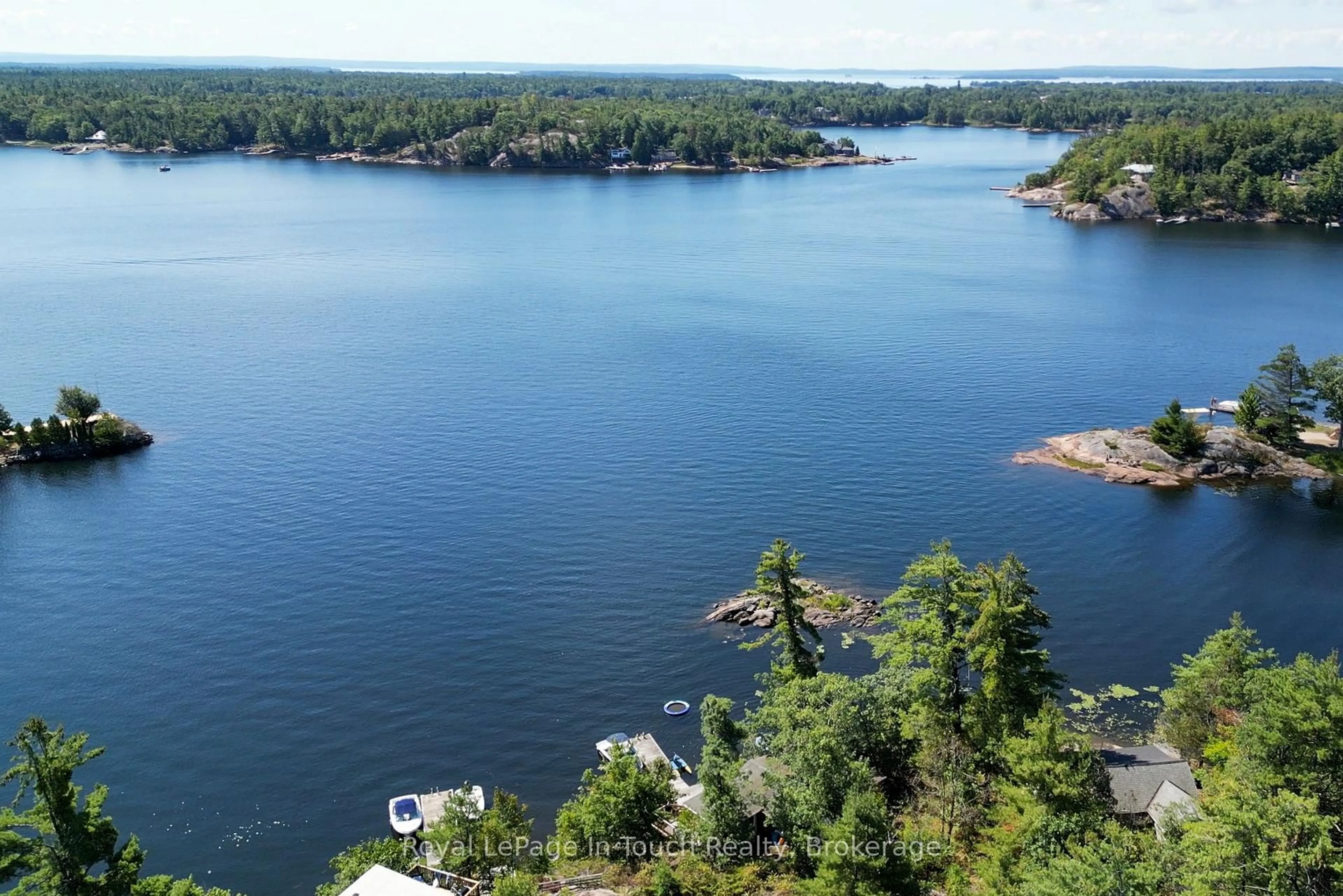A pic from outside/outdoor area/front of a property/back of a property/a pic from drone, water/lake/river/ocean view for 13182 Georgian Bay Shore, Georgian Bay Ontario P0E 1E0