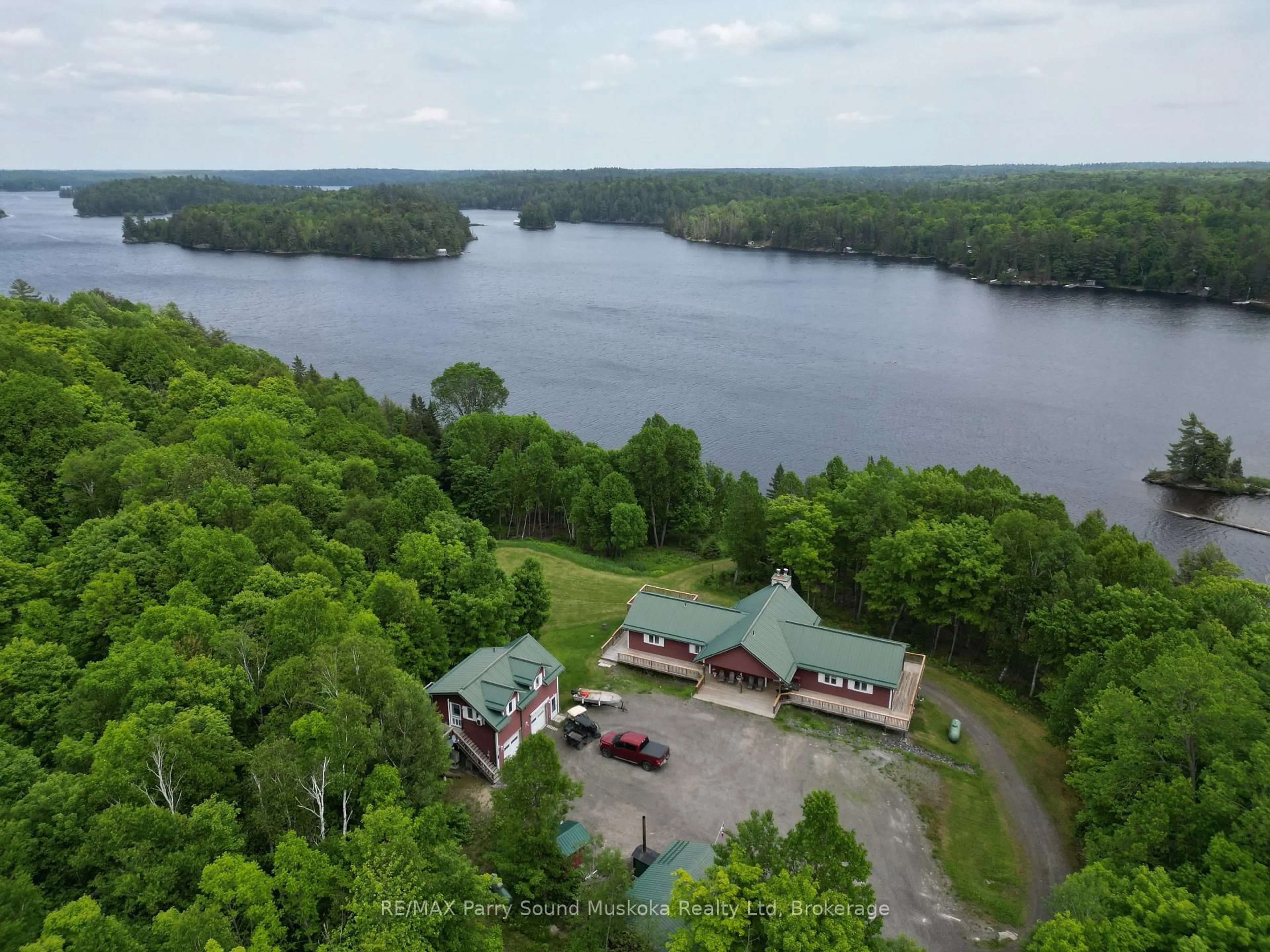 A pic from outside/outdoor area/front of a property/back of a property/a pic from drone, water/lake/river/ocean view for 1990 North Rd, Parry Sound Remote Area Ontario P0H 1S0