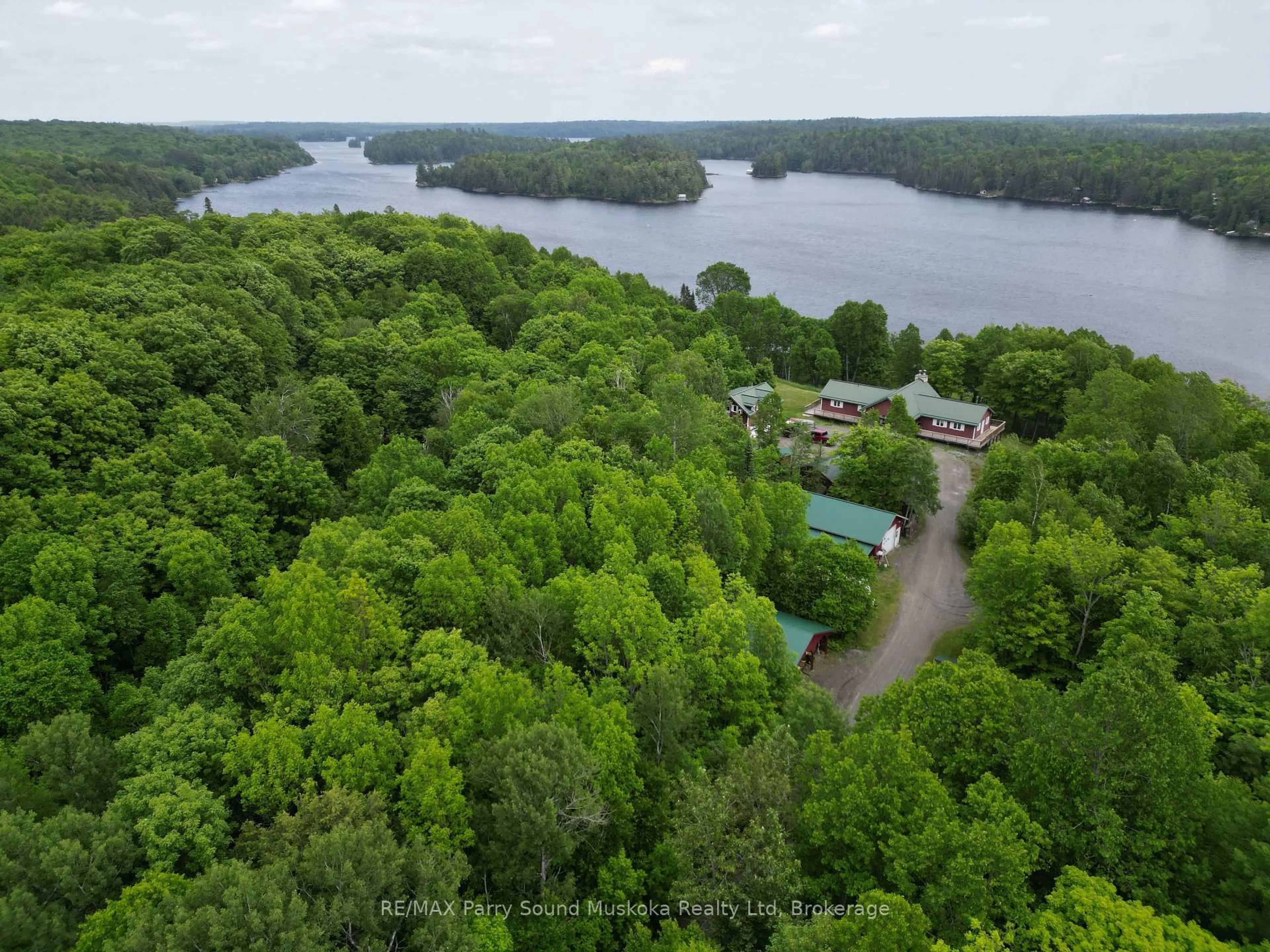 A pic from outside/outdoor area/front of a property/back of a property/a pic from drone, water/lake/river/ocean view for 1990 North Rd, Parry Sound Remote Area Ontario P0H 1S0