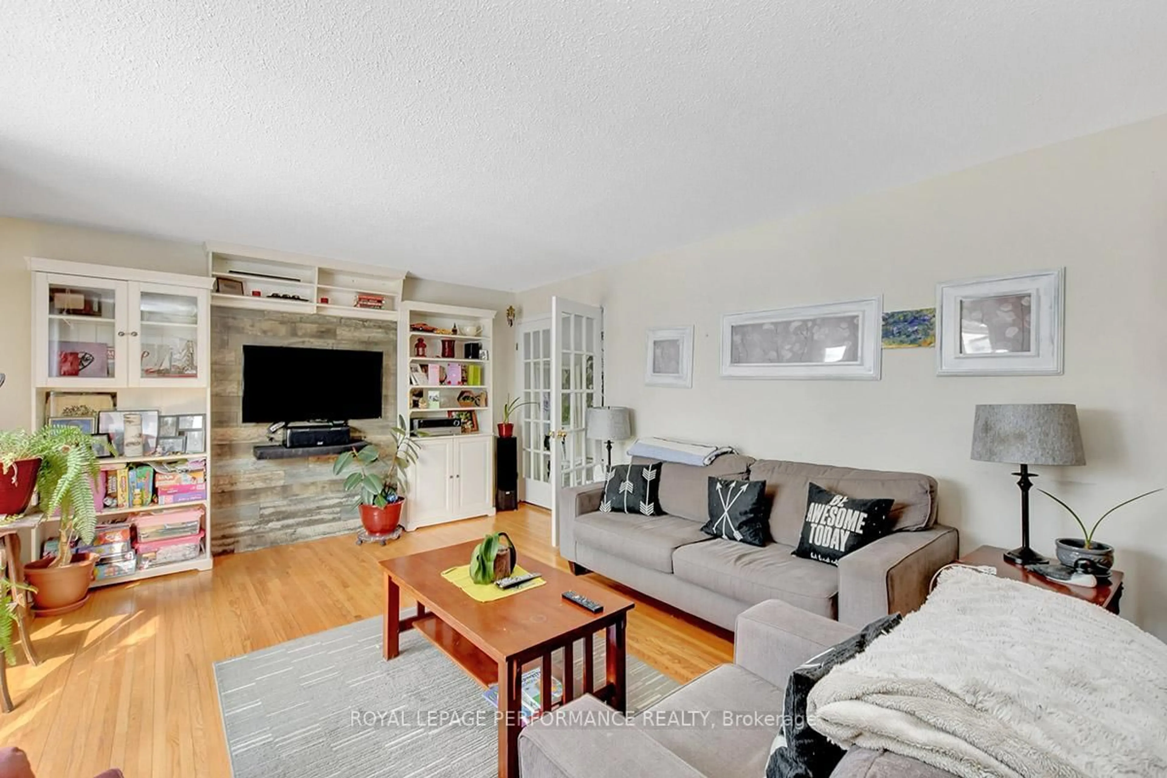 Living room with furniture, wood/laminate floor for 122 Post Rd, Ottawa Ontario K2L 1L2