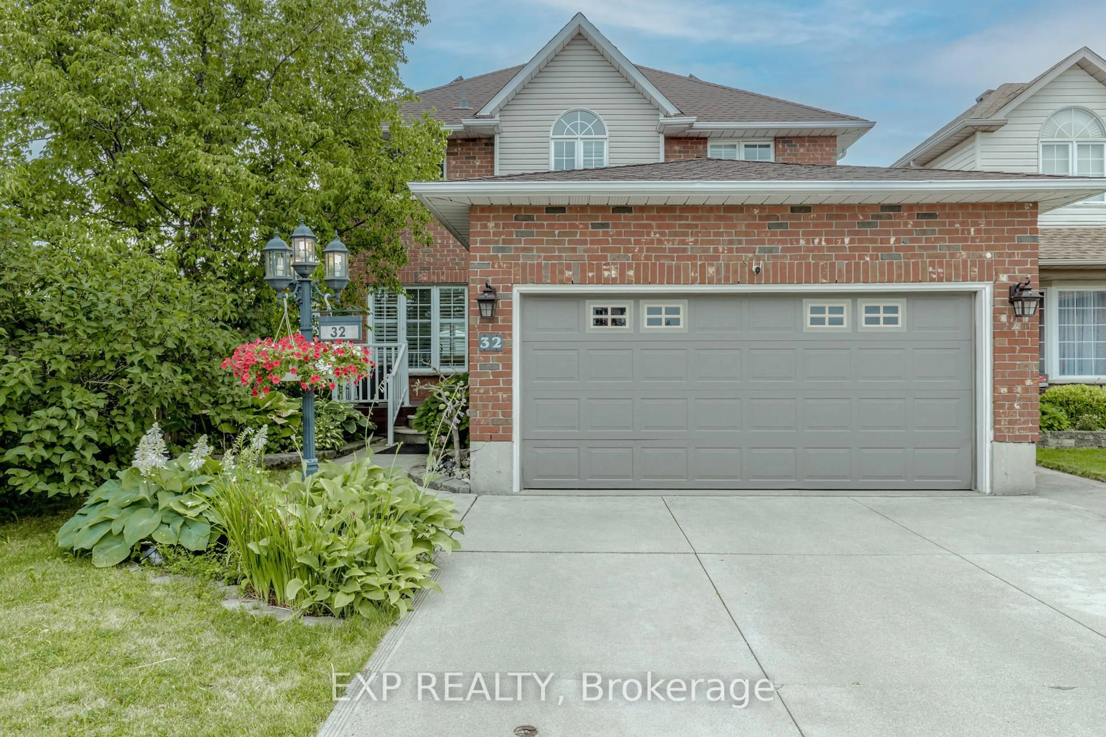 Home with brick exterior material, street for 32 Vineberg Dr, Hamilton Ontario L9B 2P6