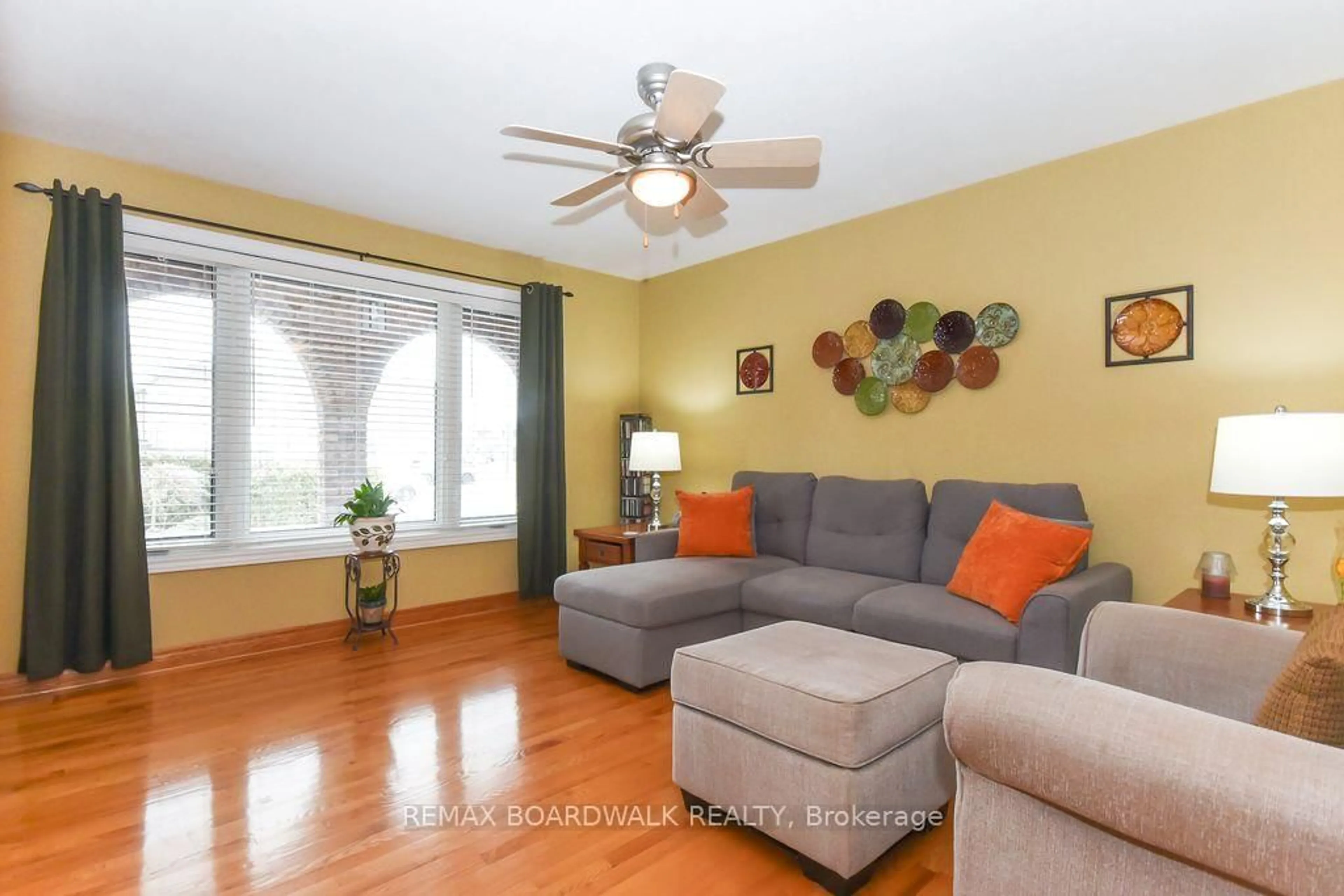 Living room with furniture, wood/laminate floor for 1408 Marchand St, Ottawa Ontario K1B 3N8