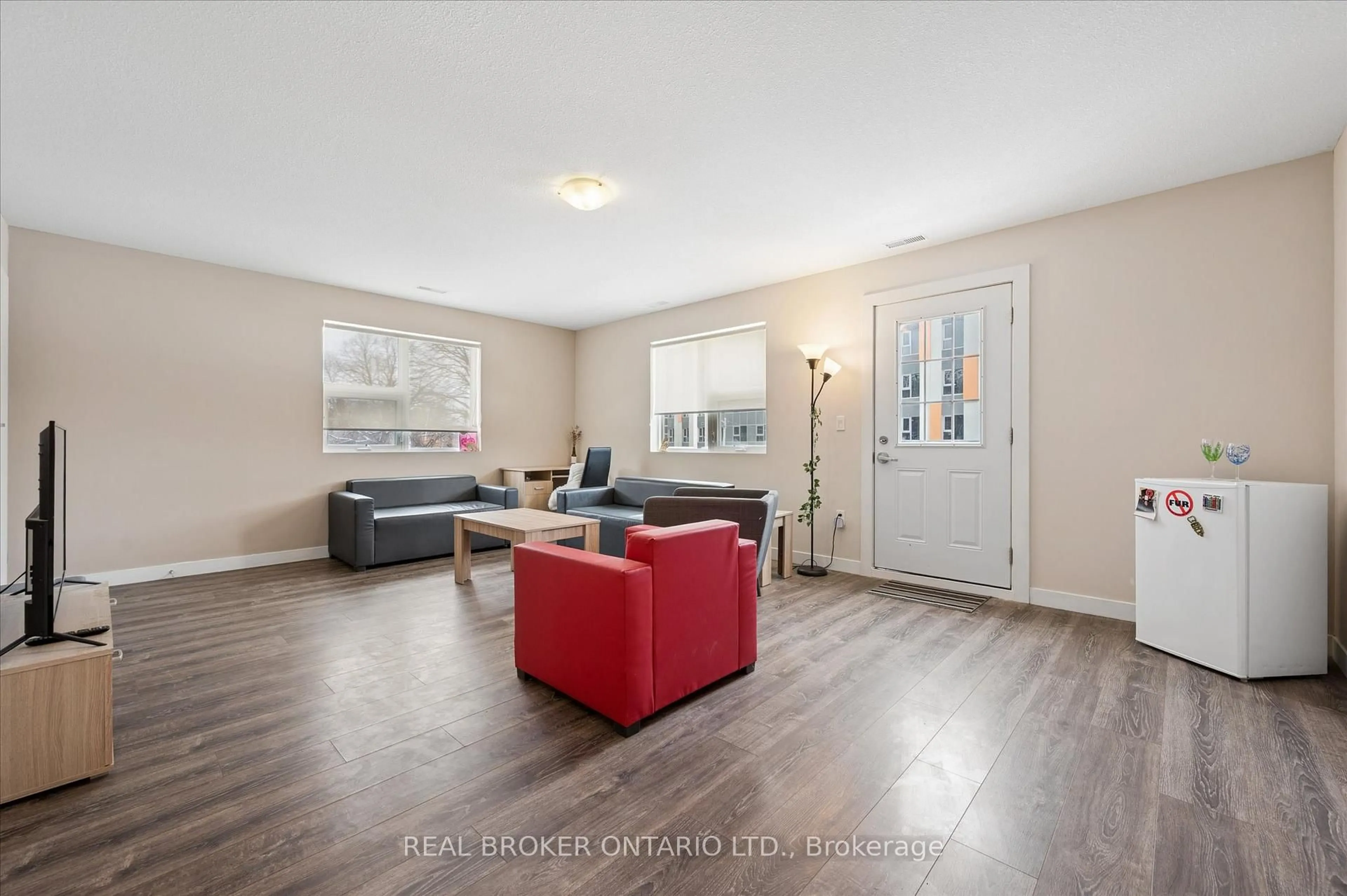 Living room with furniture, wood/laminate floor for 288 Albert St #219, Waterloo Ontario N2L 0G9
