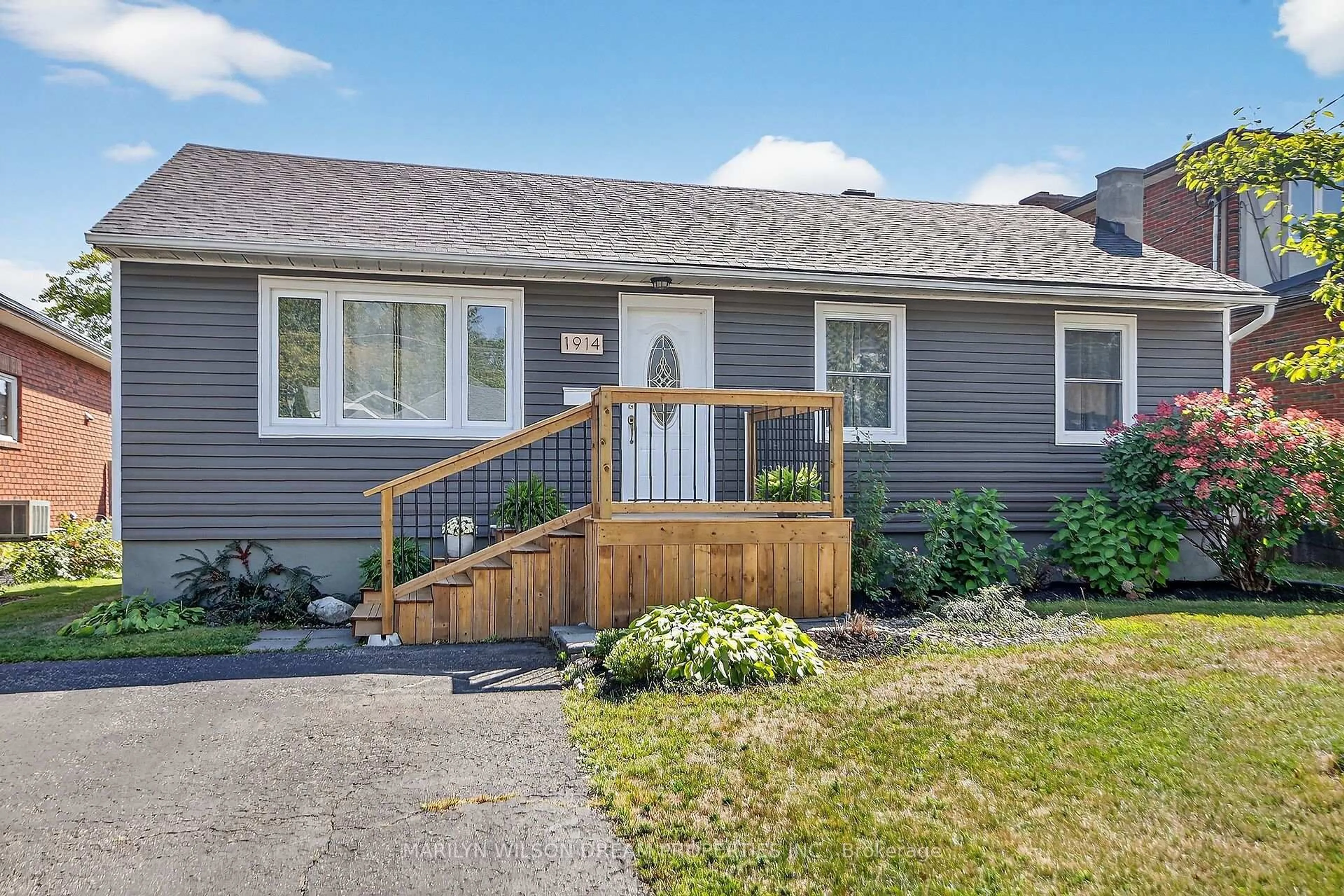 Home with vinyl exterior material, street for 1914 Rosebella Ave, Ottawa Ontario K1T 1G7