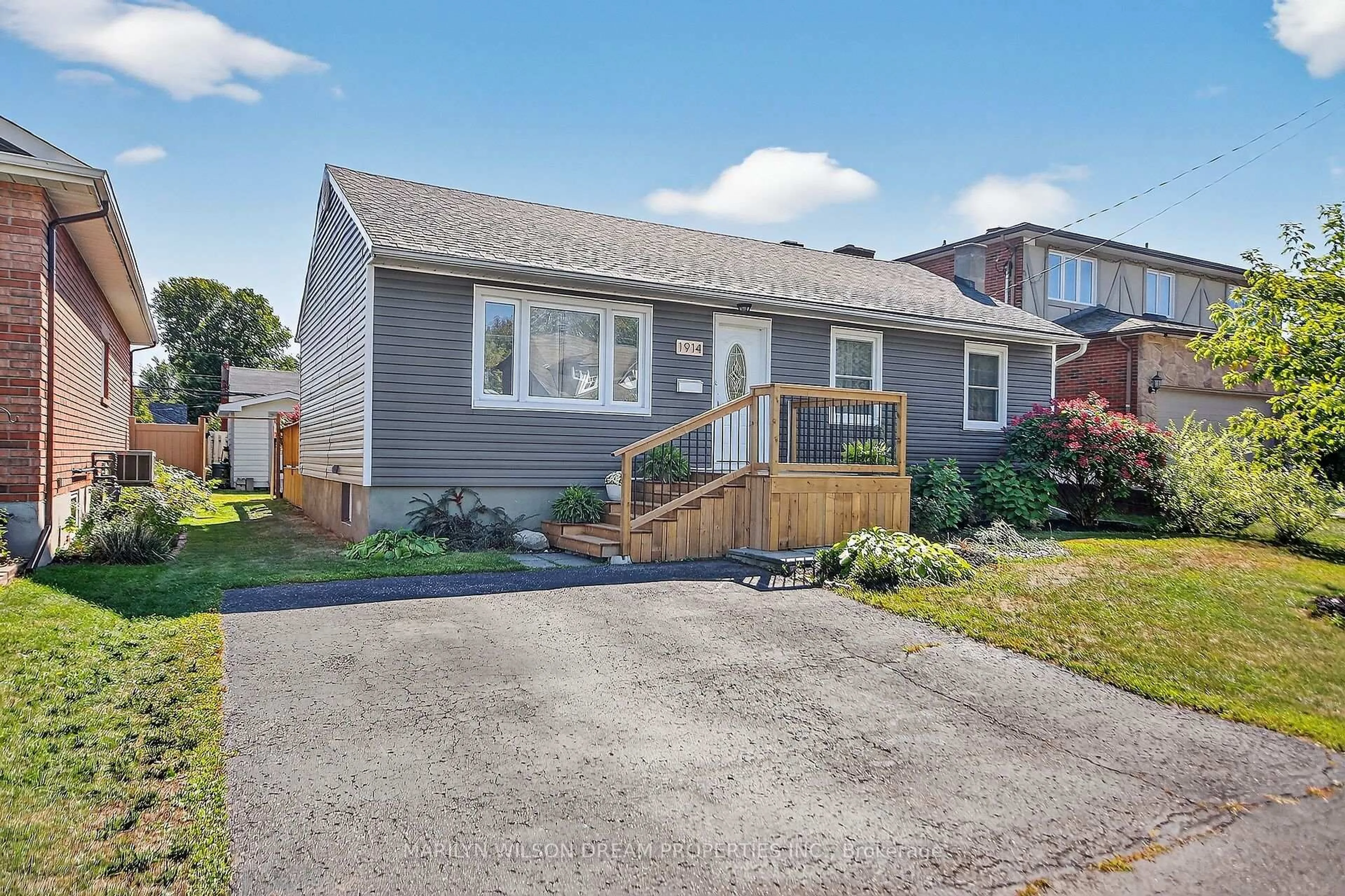 Home with vinyl exterior material, street for 1914 Rosebella Ave, Ottawa Ontario K1T 1G7