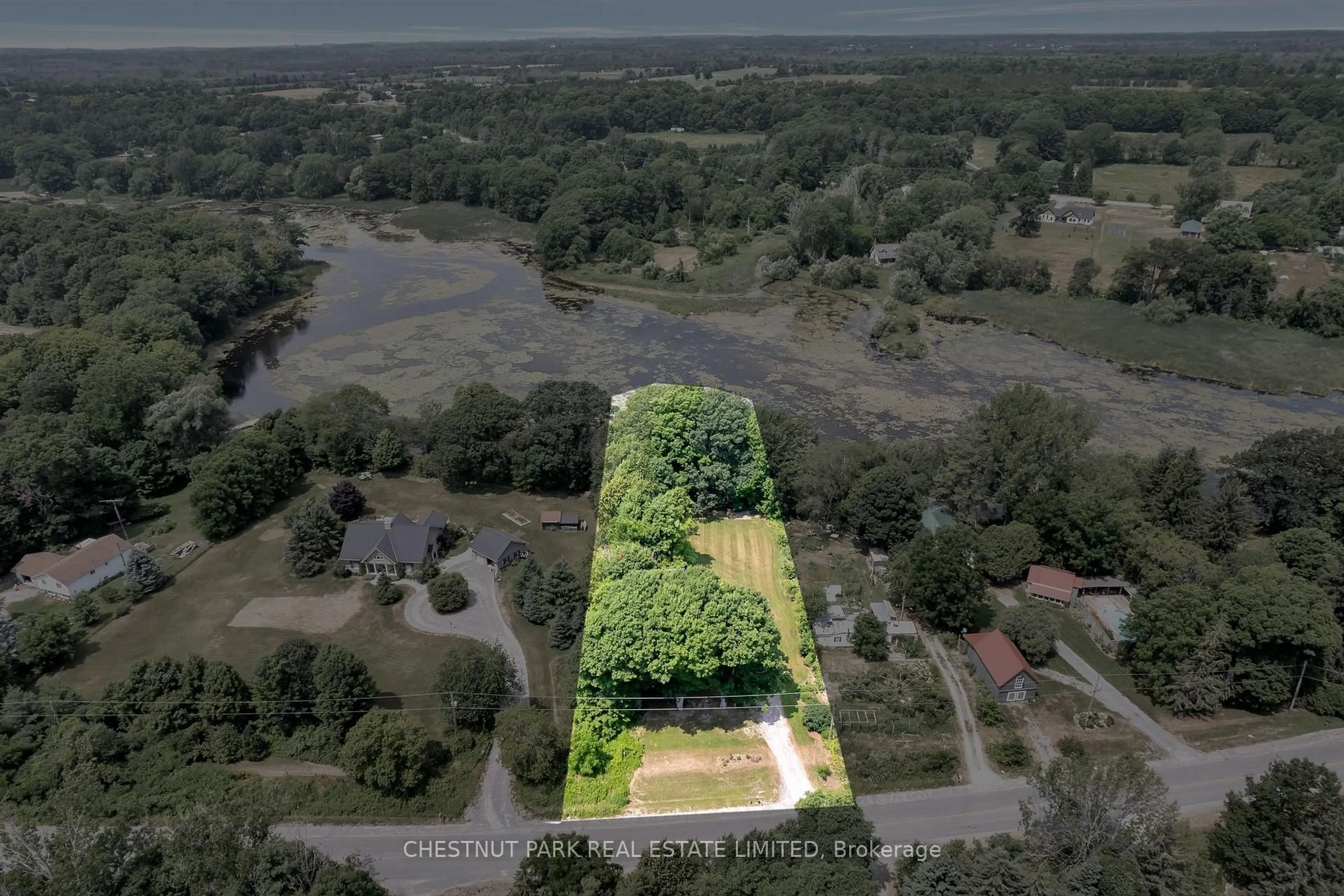 A pic from outside/outdoor area/front of a property/back of a property/a pic from drone, water/lake/river/ocean view for 976 County Rd 13, Prince Edward County Ontario K0K 2P0