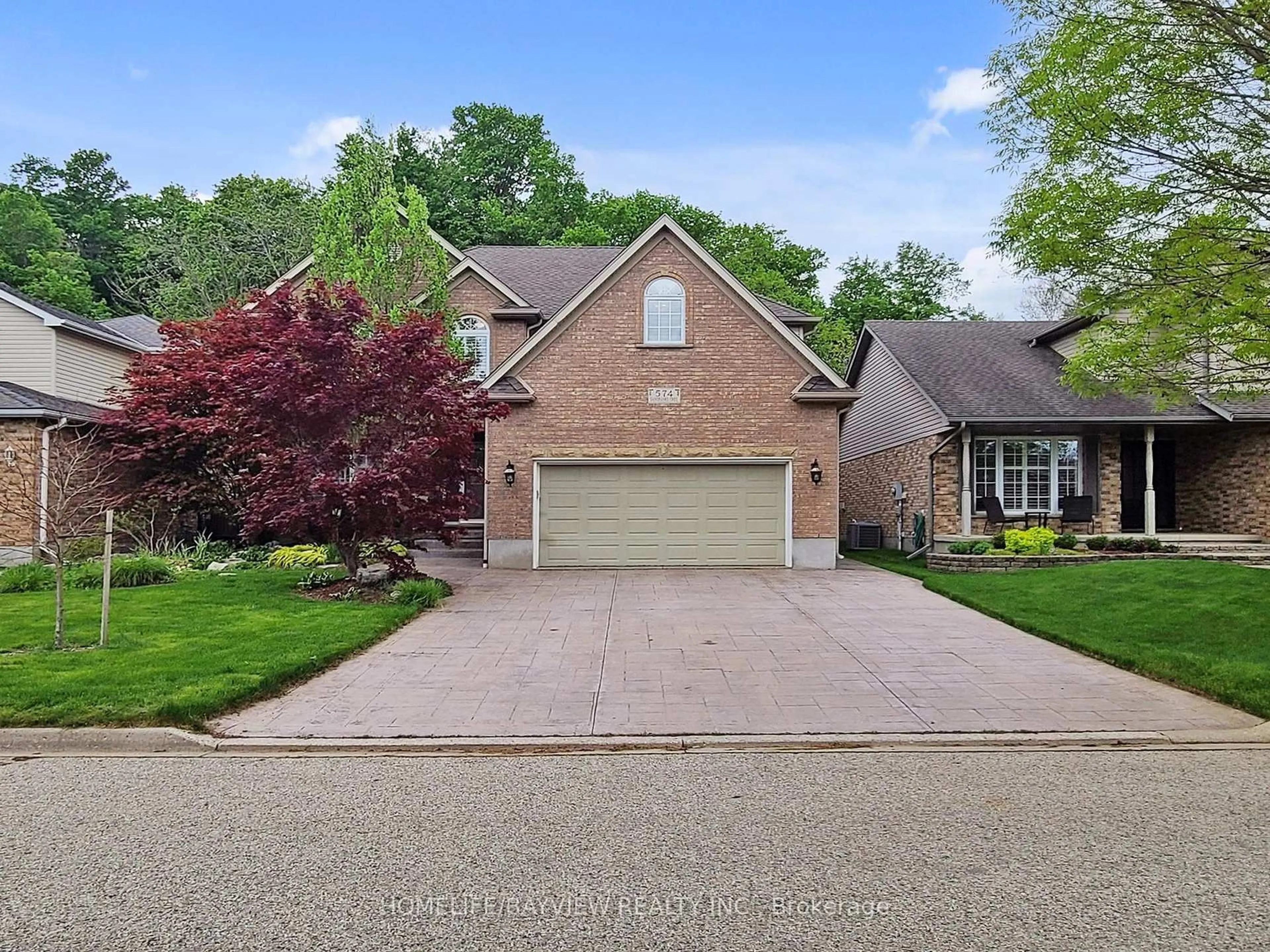 Home with brick exterior material, street for 574 Sandbanks Cres, Waterloo Ontario N2V 2K2