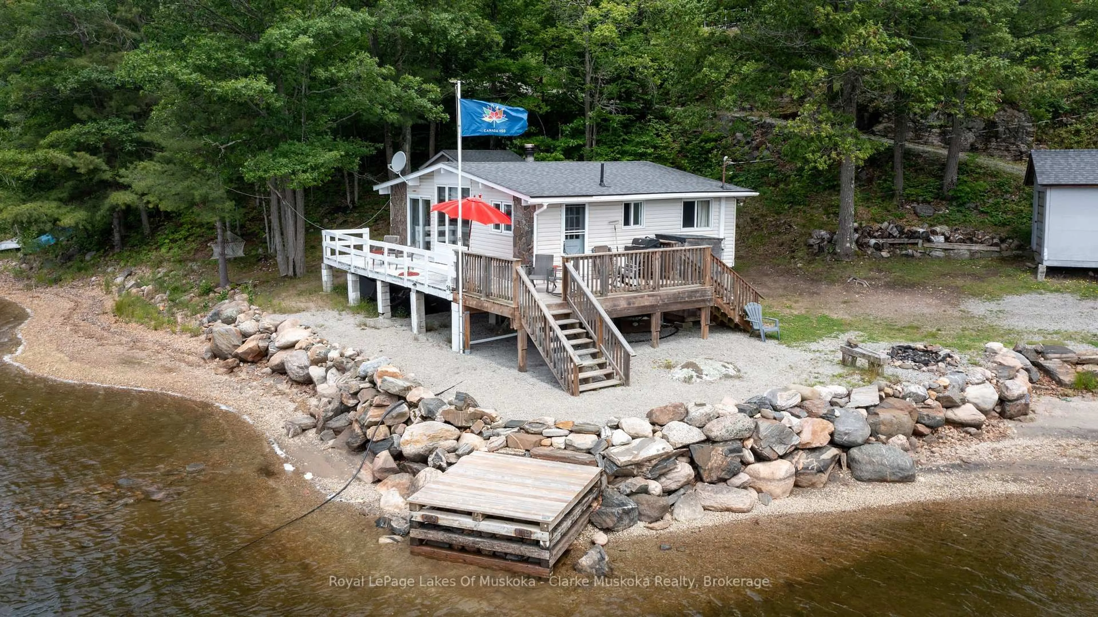 A pic from outside/outdoor area/front of a property/back of a property/a pic from drone, water/lake/river/ocean view for 709 Harrison Tr, Georgian Bay Ontario L0K 1S0