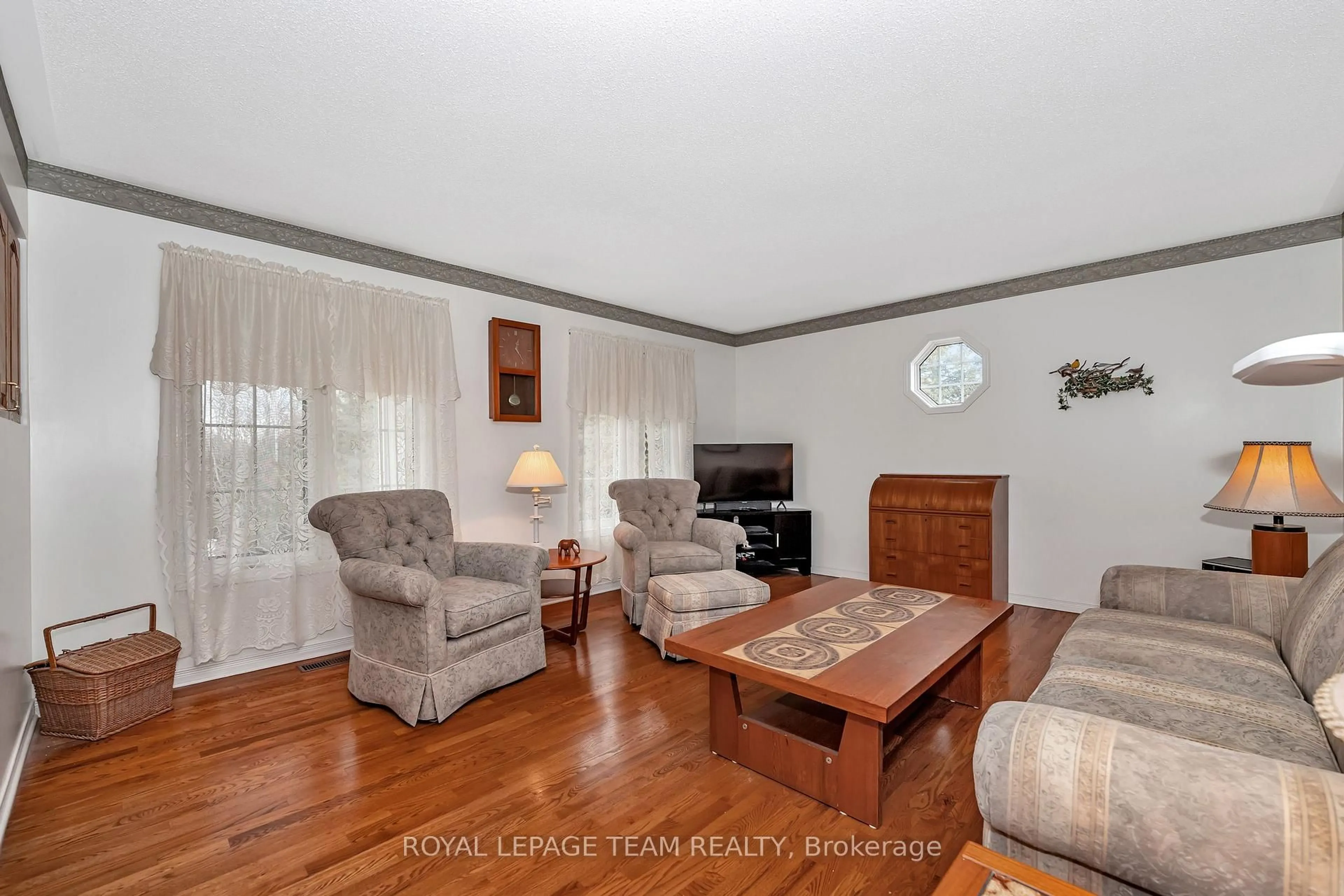 Living room with furniture, wood/laminate floor for 1961 Manotick Station Rd, Osgoode Ontario K0A 2W0