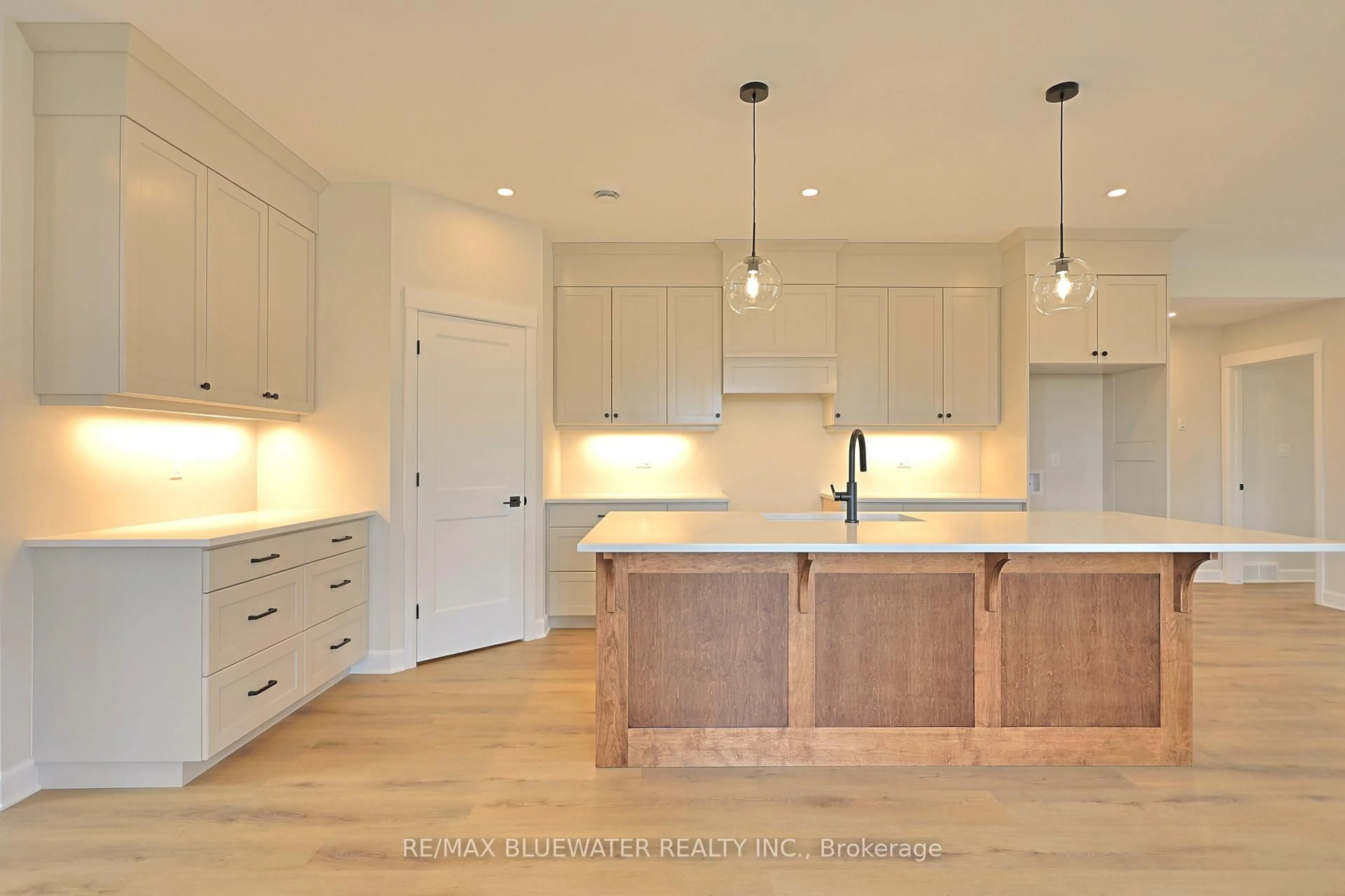 Open concept kitchen, wood/laminate floor for 72623 Stanley St, Bluewater Ontario N0M 2T0