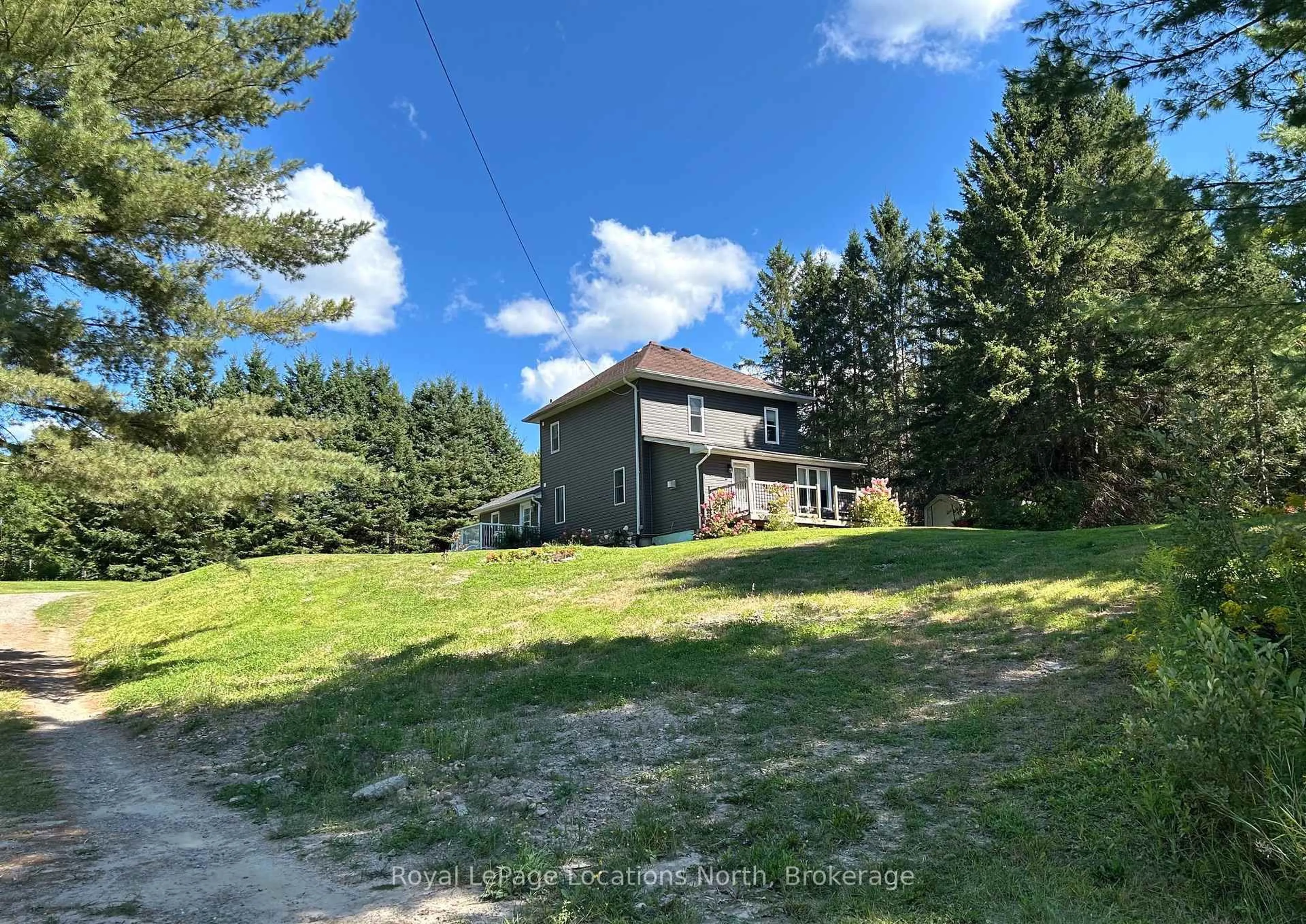 A pic from outside/outdoor area/front of a property/back of a property/a pic from drone, unknown for 205 First Ave, Armour Ontario P0A 1C0