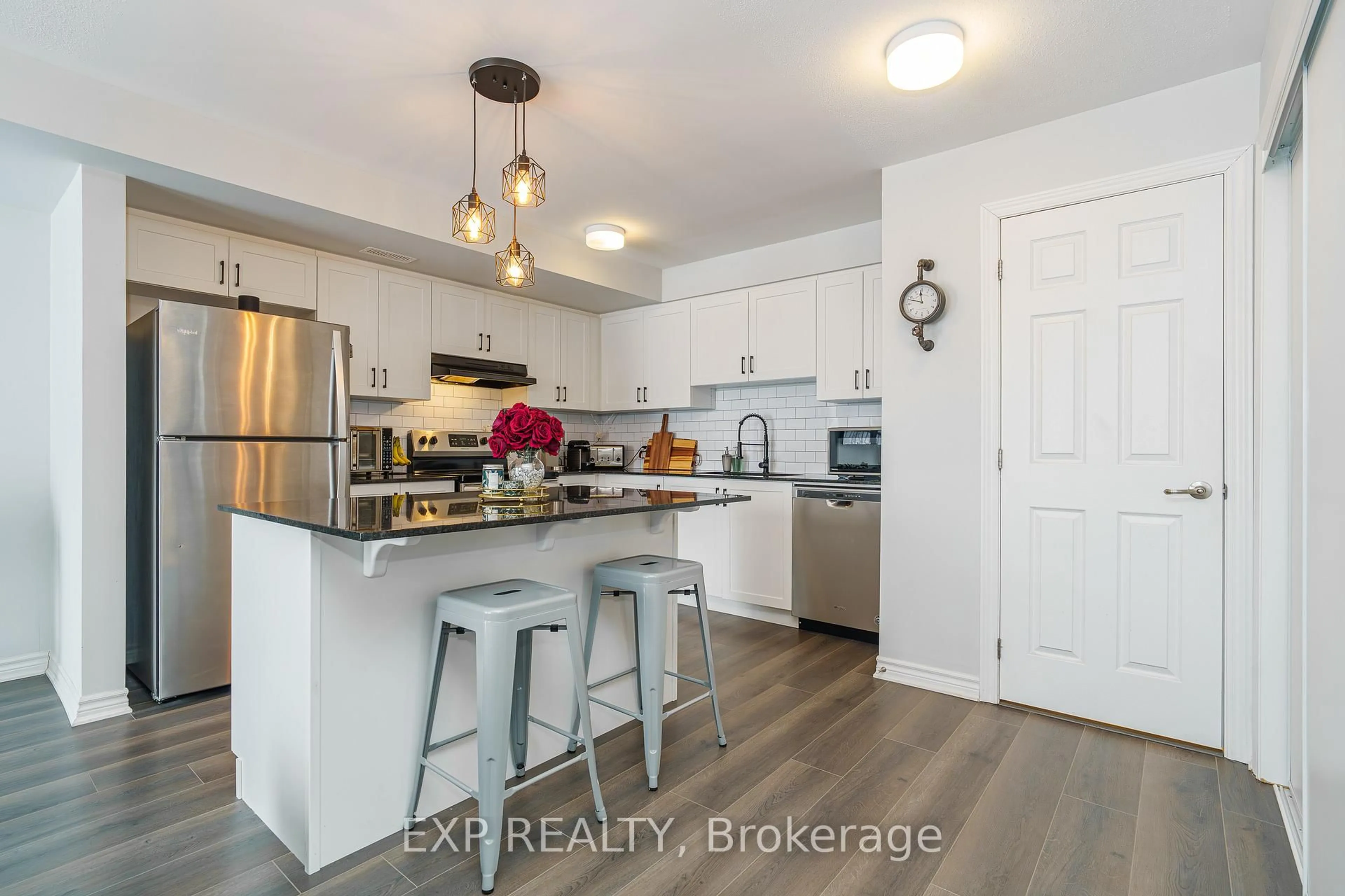 Open concept kitchen, wood/laminate floor for 852 Atlas Terr, Ottawa Ontario K2V 0S3