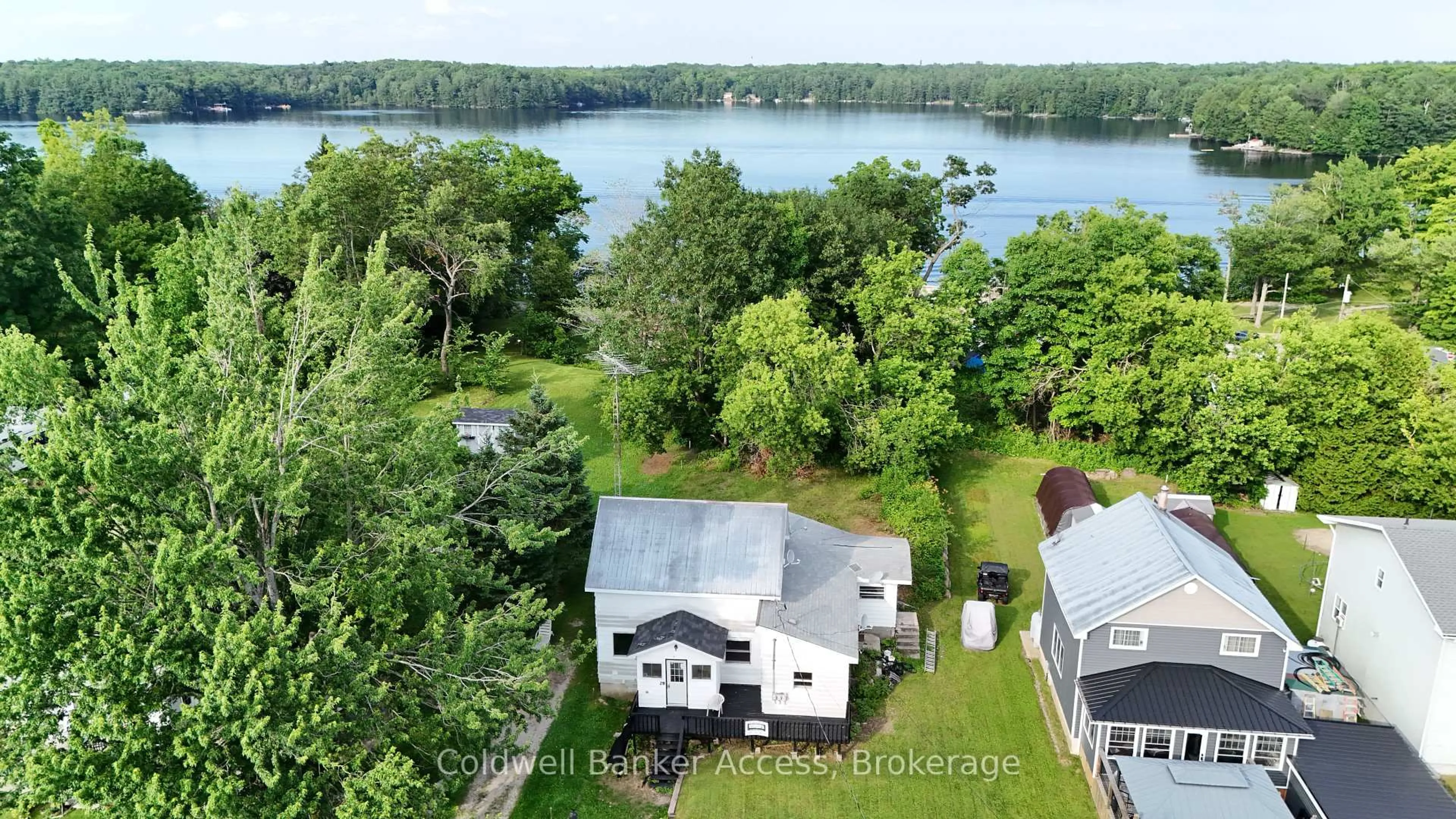 A pic from outside/outdoor area/front of a property/back of a property/a pic from drone, water/lake/river/ocean view for 29 Railway St #1, 2, and 3, Georgian Bay Ontario P0C 1H0