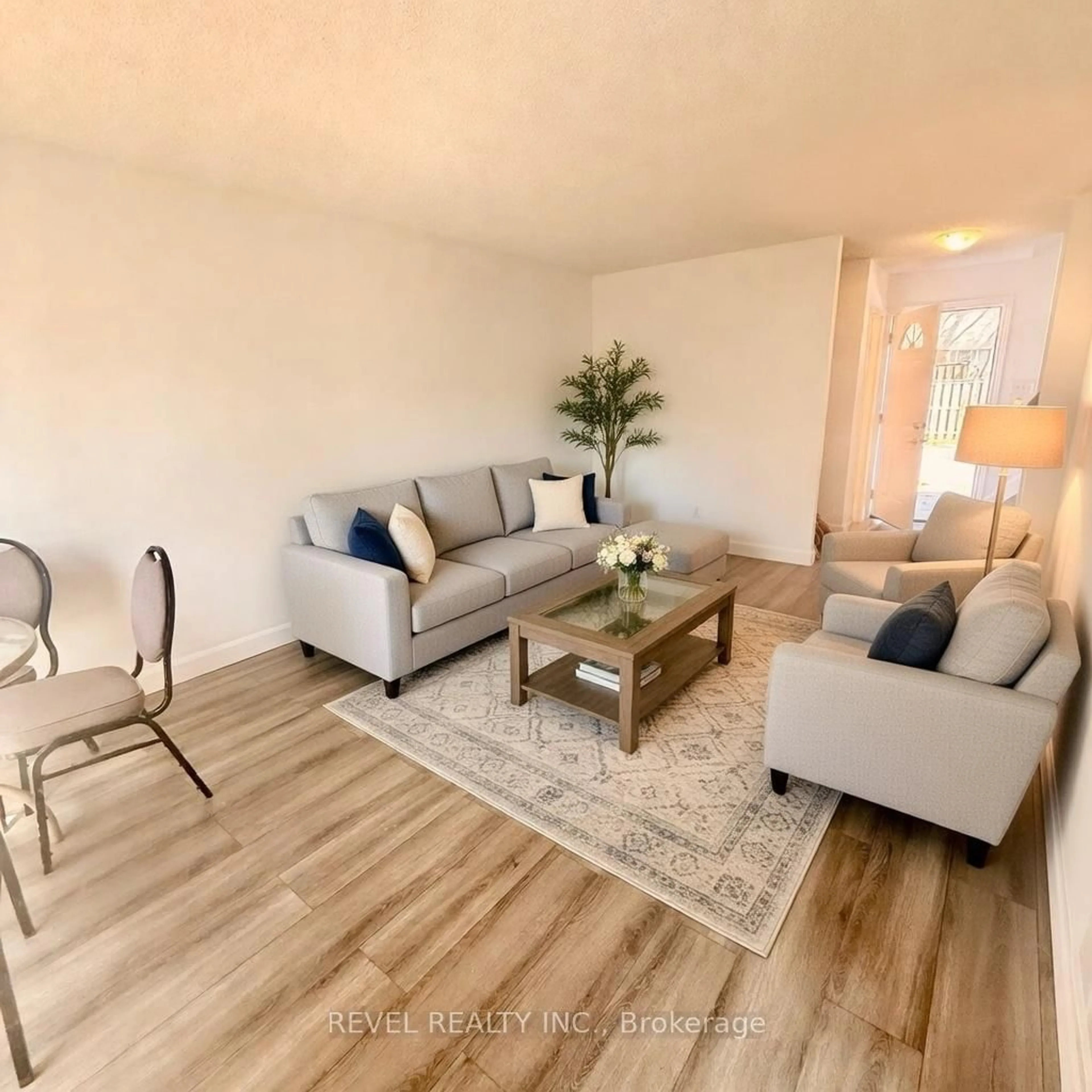 Living room with furniture, wood/laminate floor for 873 Southdale Rd, London South Ontario N6E 1V7