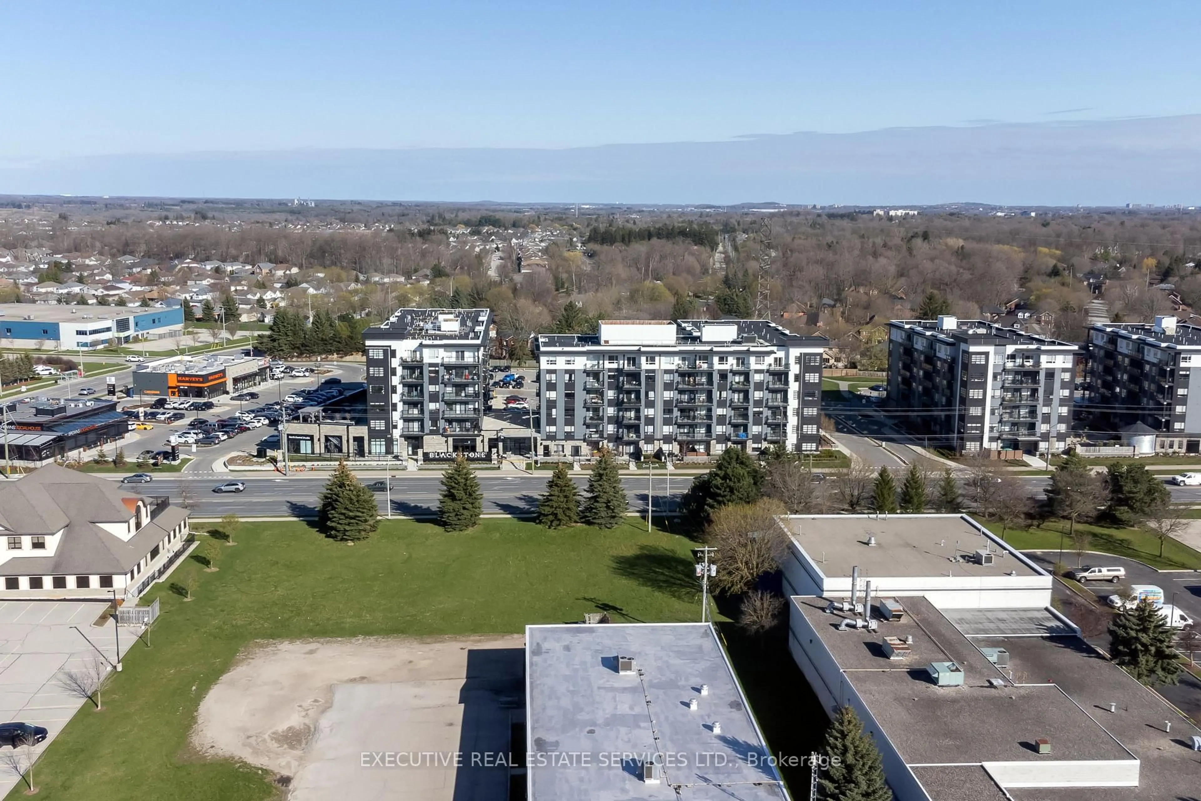 A pic from outside/outdoor area/front of a property/back of a property/a pic from drone, city buildings view from balcony for 251 Northfield Dr #322, Waterloo Ontario N2K 0G9