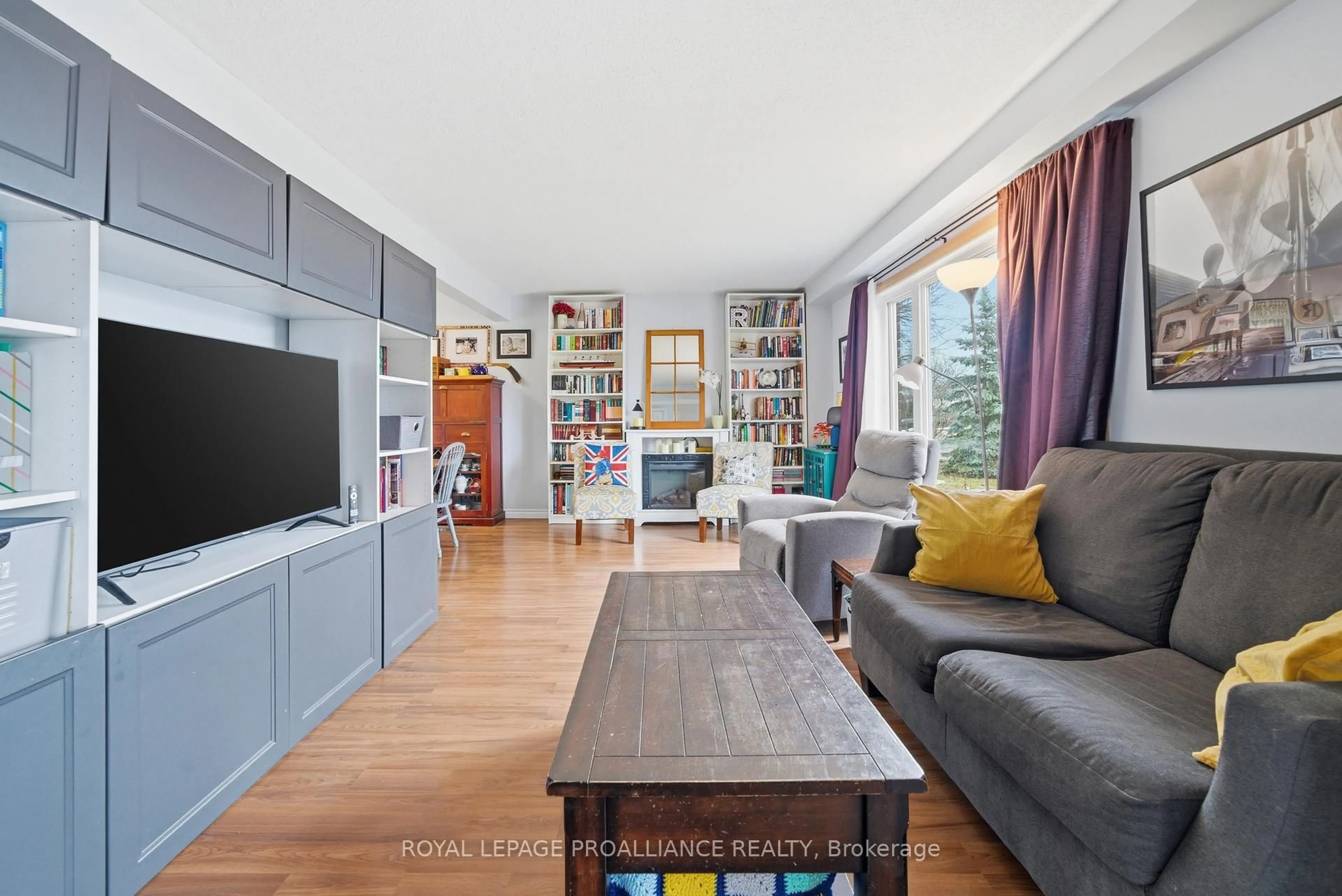 Living room with furniture, wood/laminate floor for 24 Austin St, Quinte West Ontario K8V 1Z4