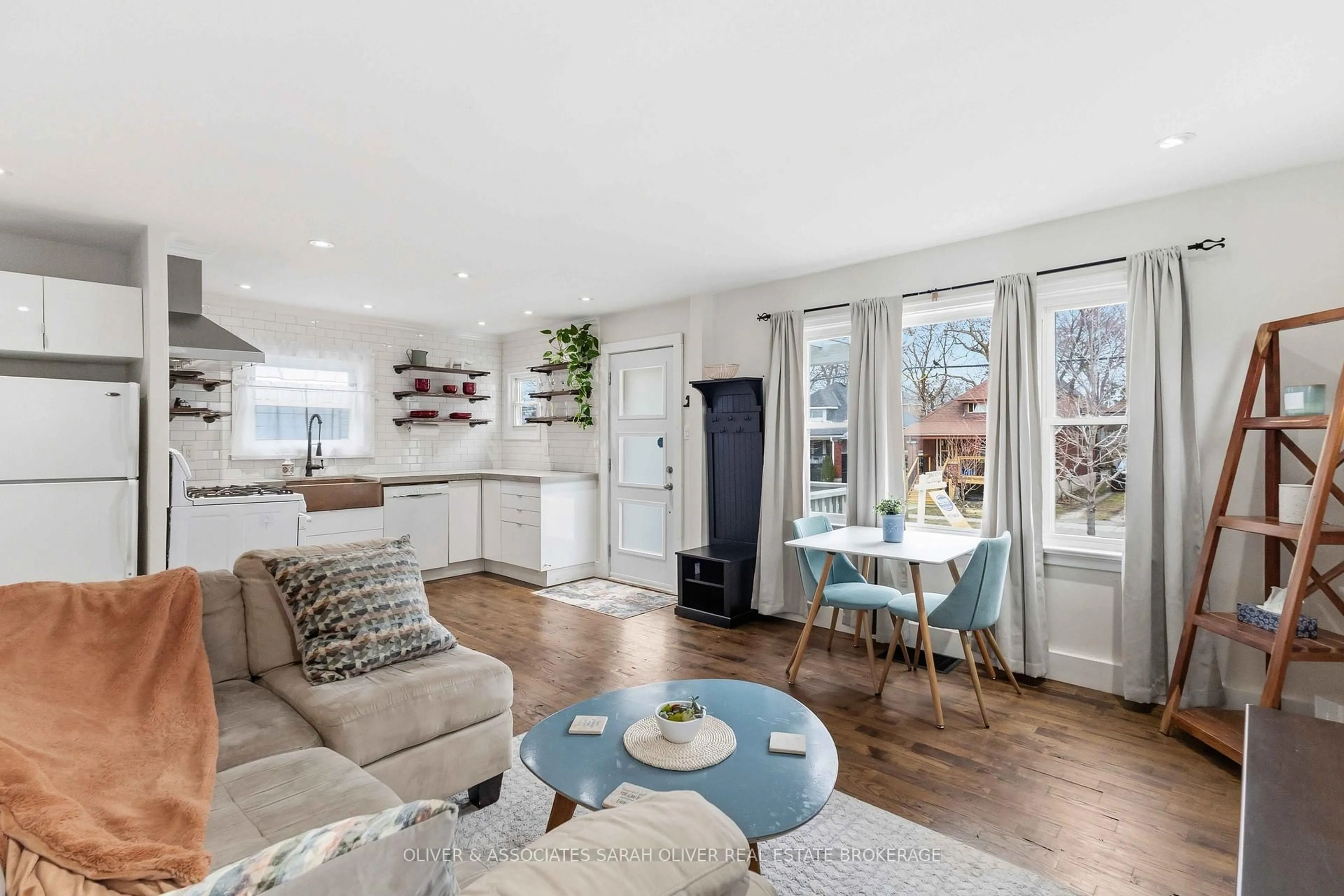 Living room with furniture, wood/laminate floor for 1287 York St, London East Ontario N5W 2V5