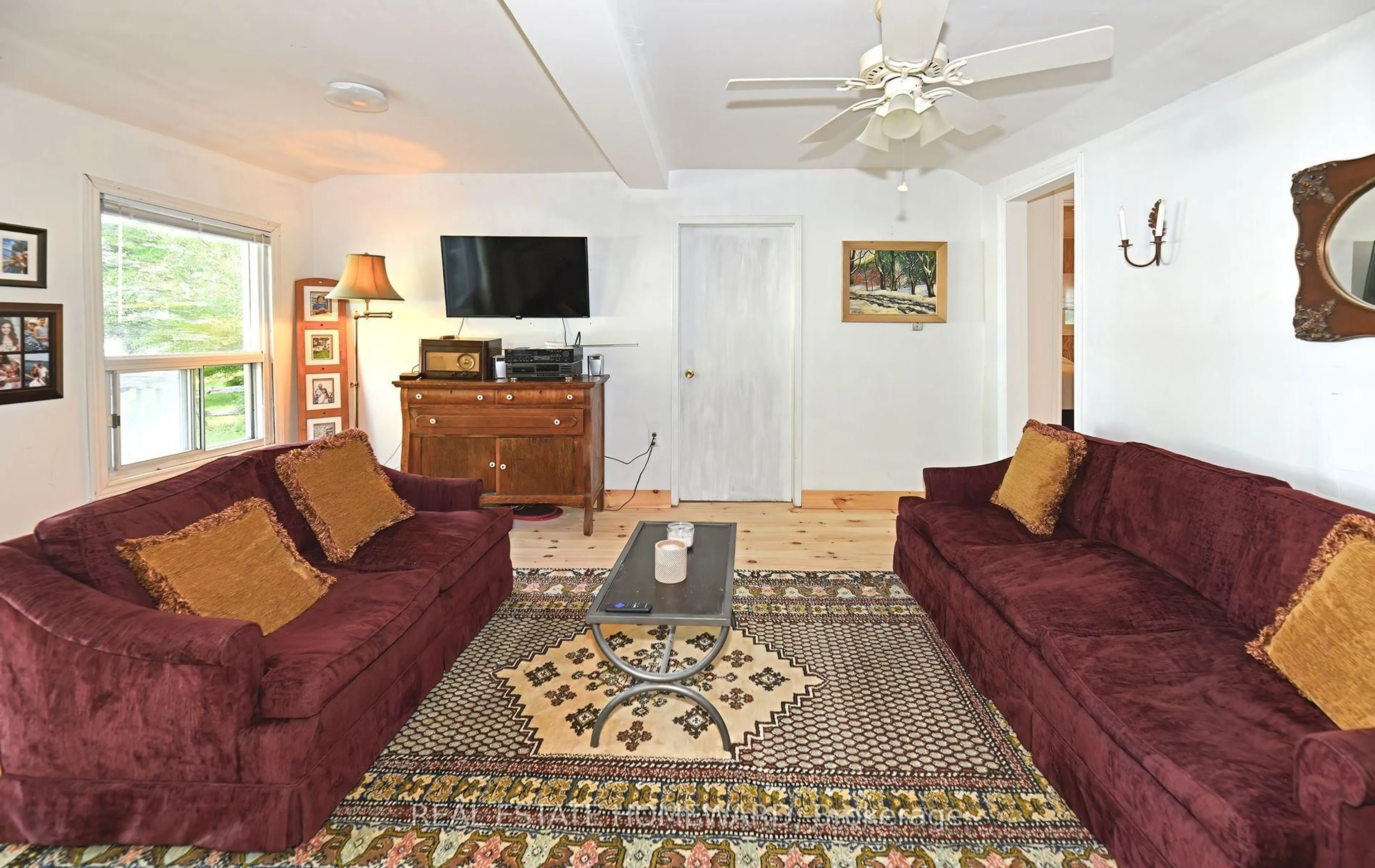 Living room with furniture, carpet floor for 260 South Shores Rd, Trent Hills Ontario K0L 1L0