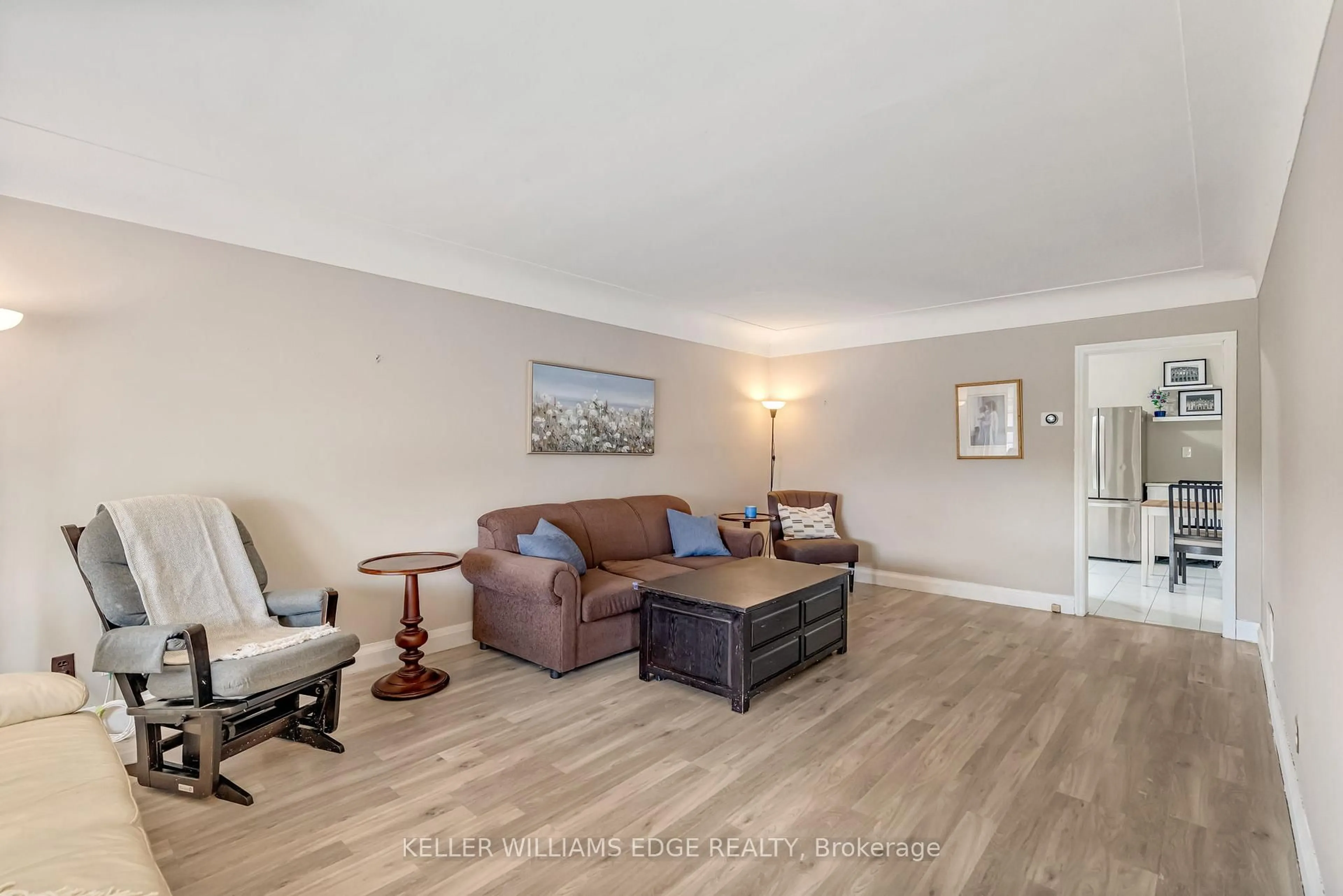 Living room with furniture, wood/laminate floor for 165 Rosewood Rd, Hamilton Ontario L8K 3J3