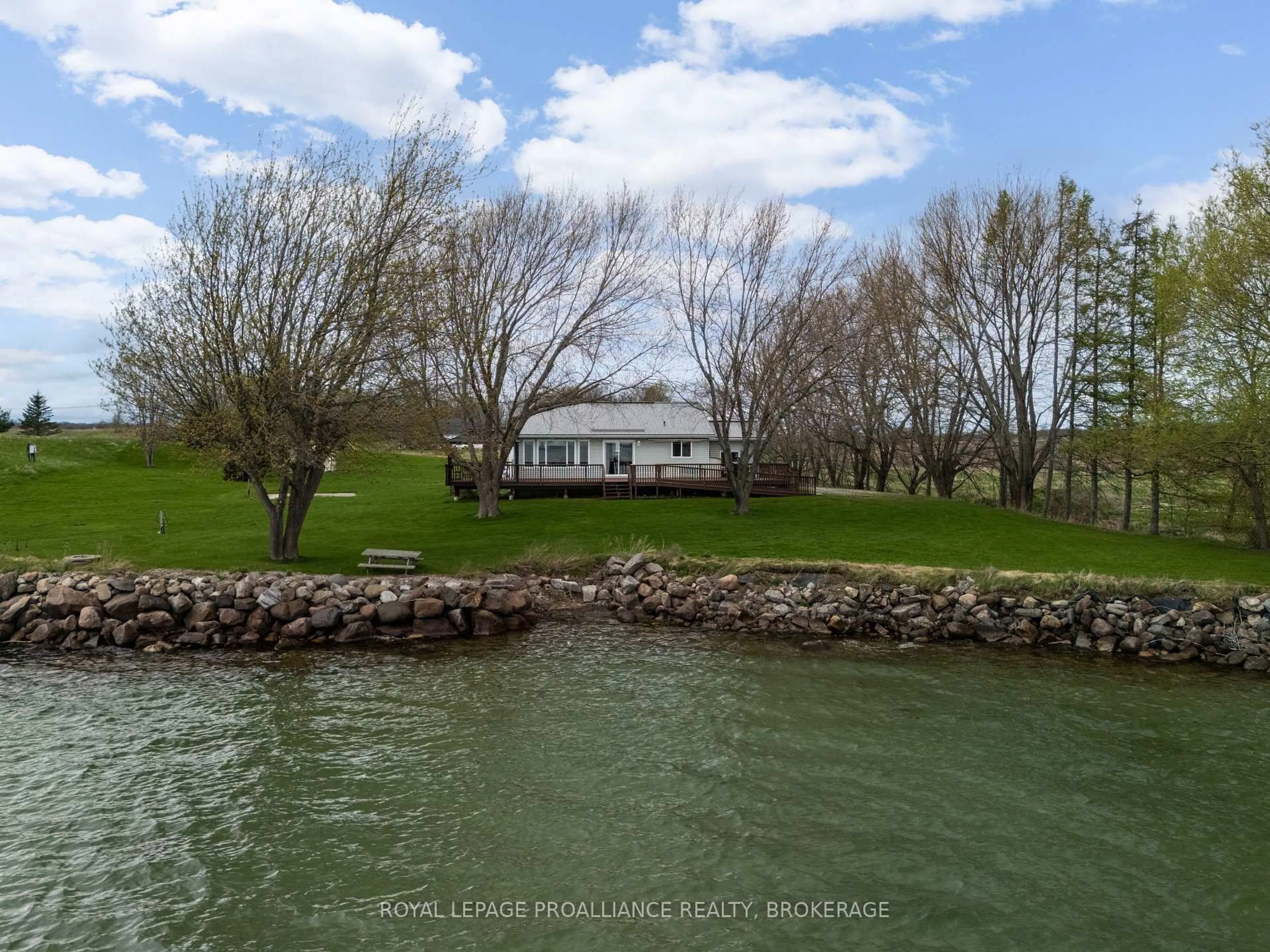 A pic from outside/outdoor area/front of a property/back of a property/a pic from drone, water/lake/river/ocean view for 4205 Highway 96, Wolfe Island Ontario K0H 2Y0