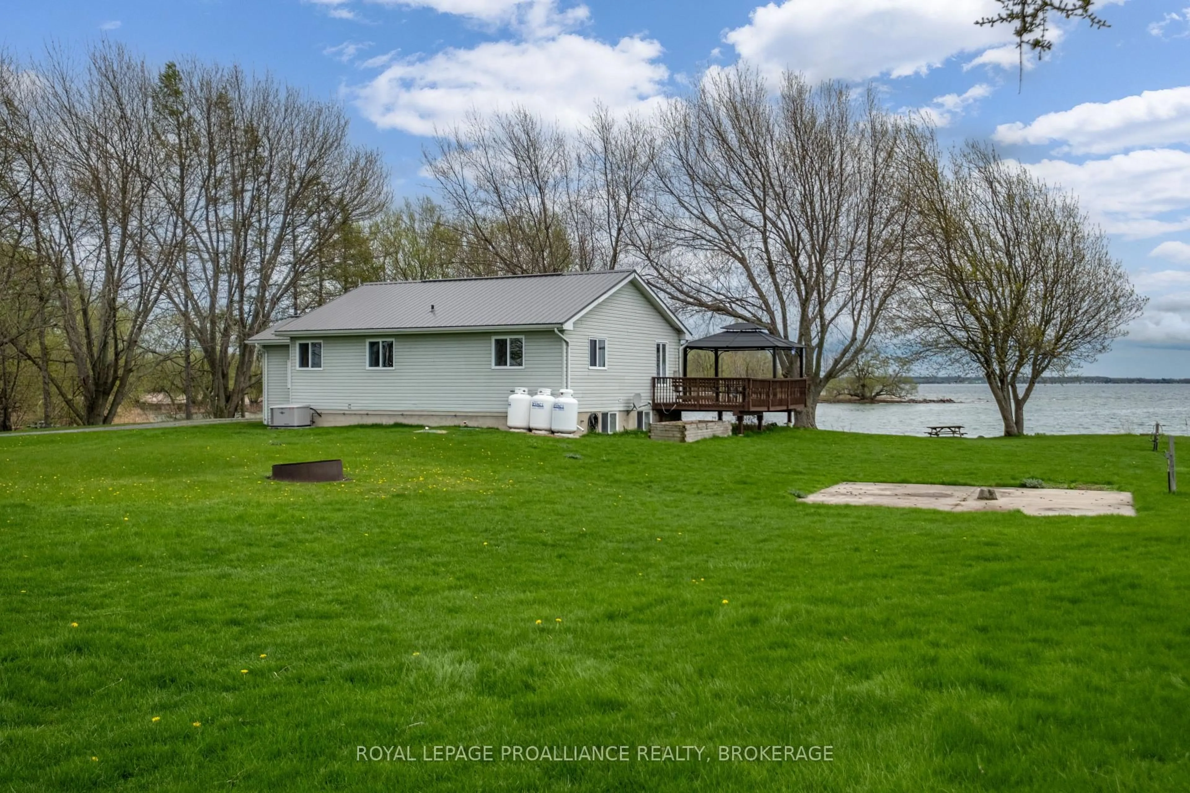 A pic from outside/outdoor area/front of a property/back of a property/a pic from drone, water/lake/river/ocean view for 4205 Highway 96, Wolfe Island Ontario K0H 2Y0