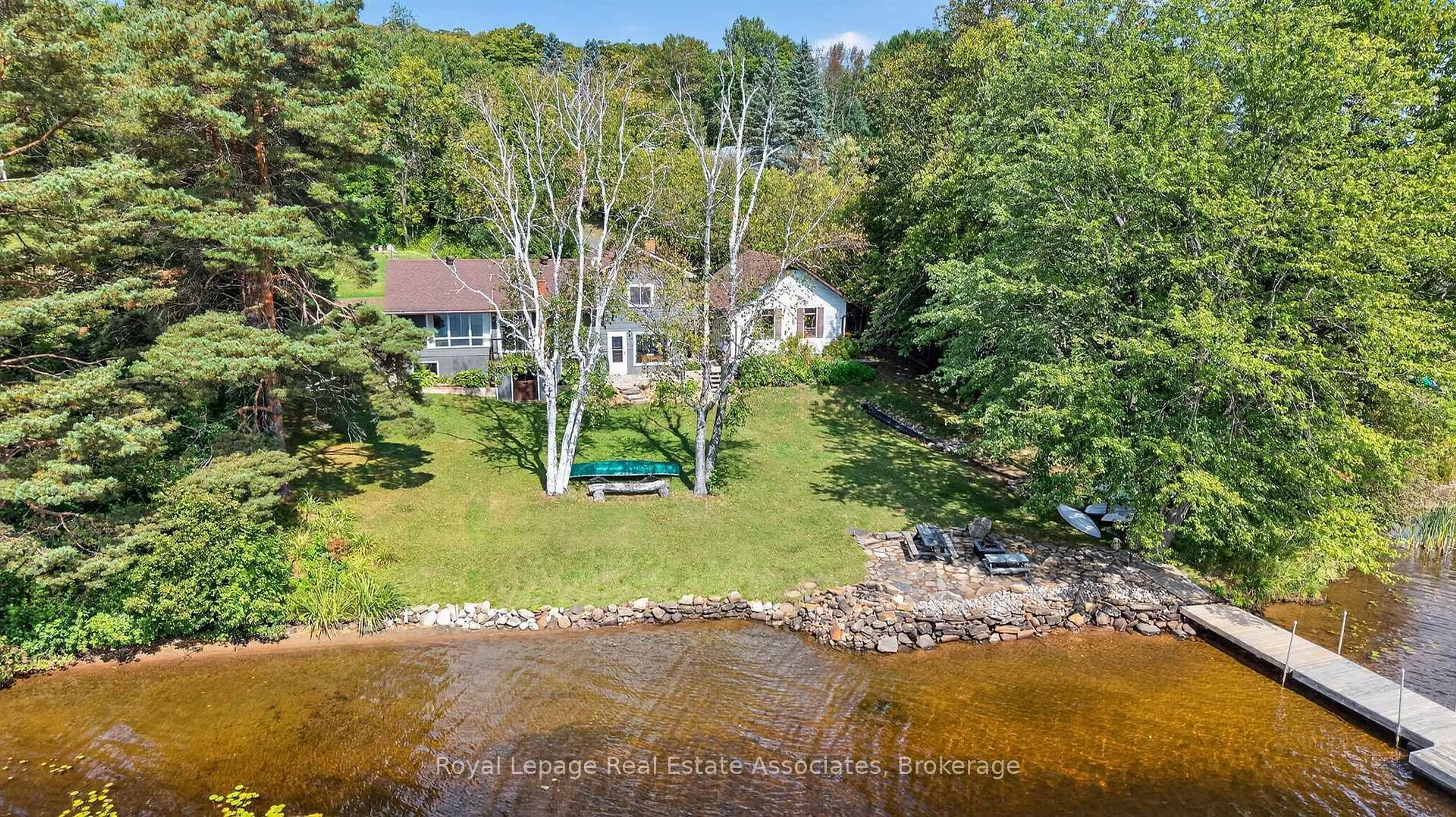 A pic from outside/outdoor area/front of a property/back of a property/a pic from drone, water/lake/river/ocean view for 389 Falcon Rd, Huntsville Ontario P1H 1N3
