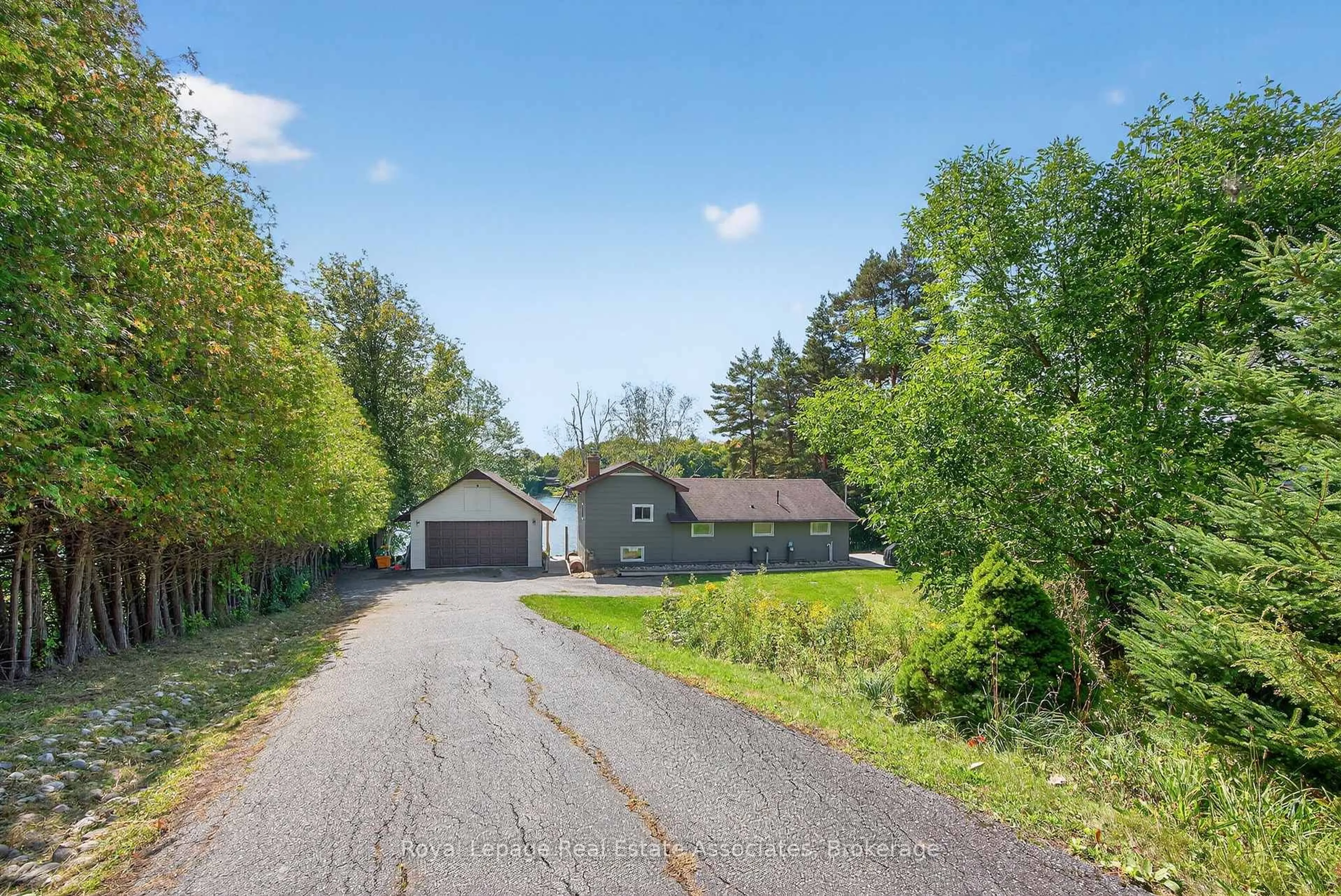A pic from outside/outdoor area/front of a property/back of a property/a pic from drone, street for 389 Falcon Rd, Huntsville Ontario P1H 1N3