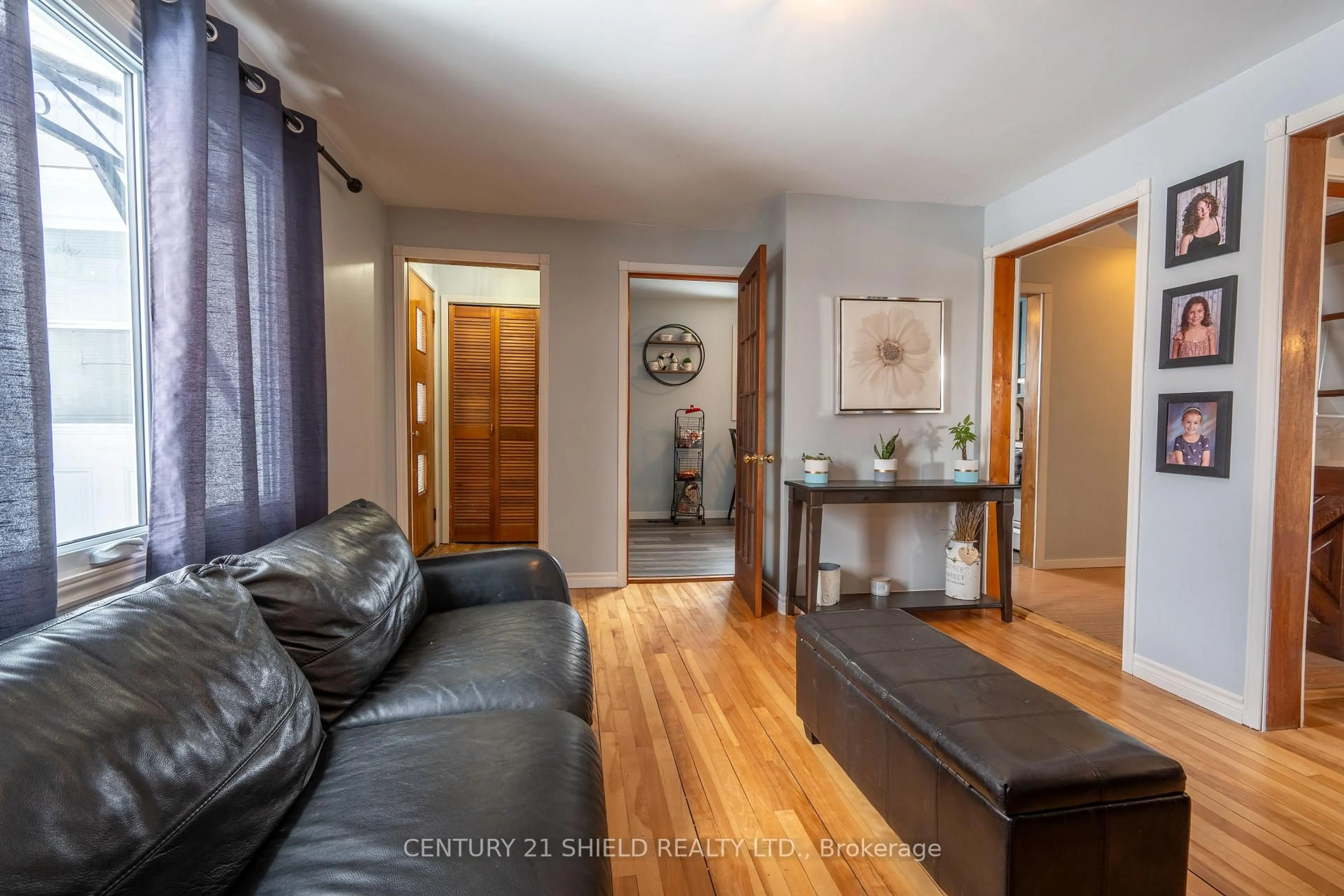 Living room with furniture, wood/laminate floor for 1005 Third St, Cornwall Ontario K6H 2E9